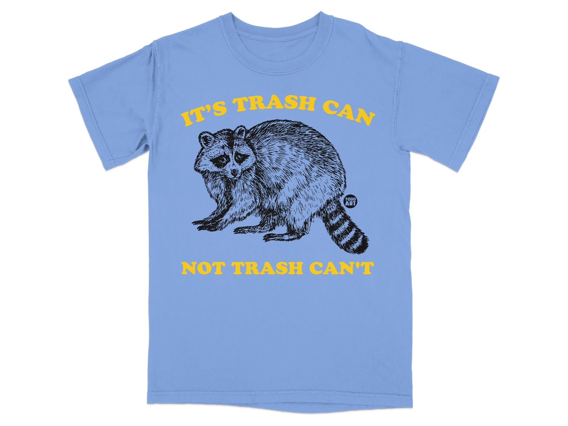 Light blue t-shirt with a raccoon graphic and "IT'S TRASH CAN NOT TRASH CAN'T" text.