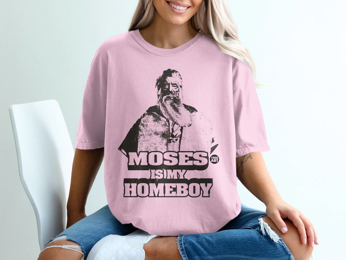 Pink t-shirt with "Moses is my homeboy" text and a portrait of Moses.