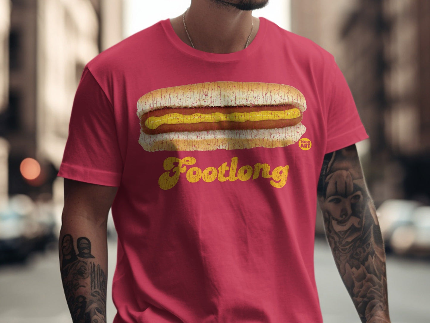 Red t-shirt with a graphic of a footlong hot dog and the text "Footlong".