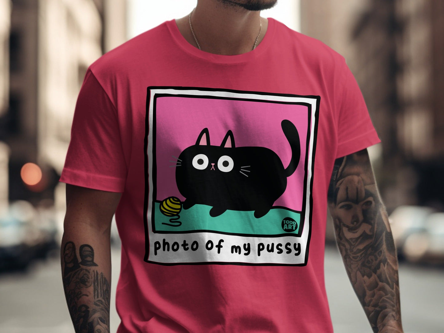 Black cat with yarn ball on t-shirt, "PHOTO OF MY PUSSY" text.