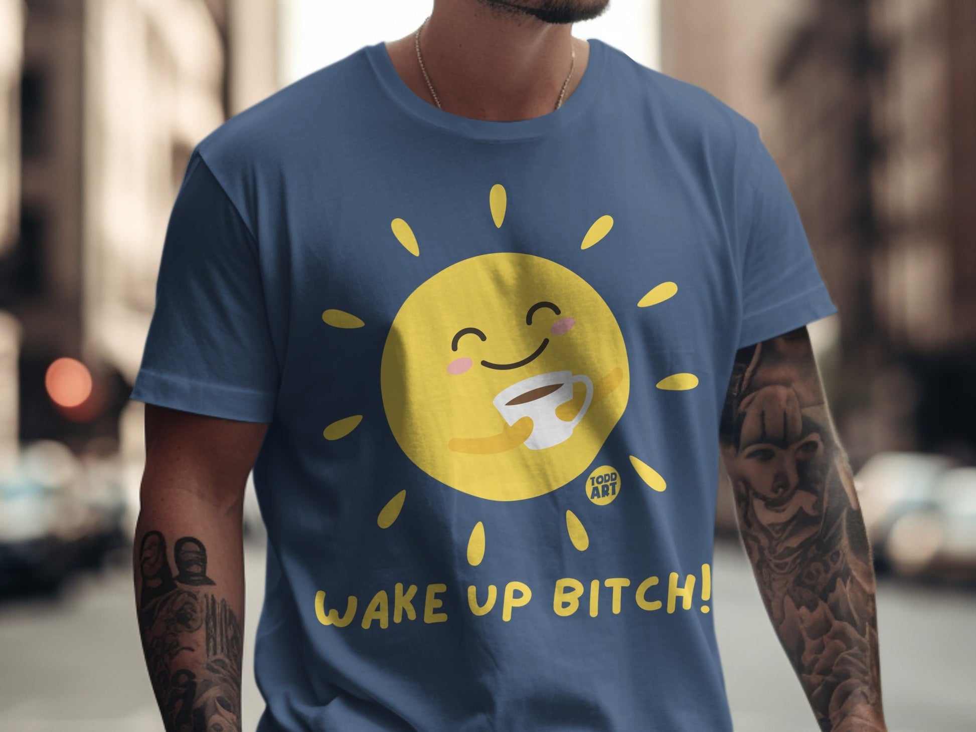 Dark blue t-shirt with smiling sun holding a coffee mug, "Wake Up Bitch!" text.