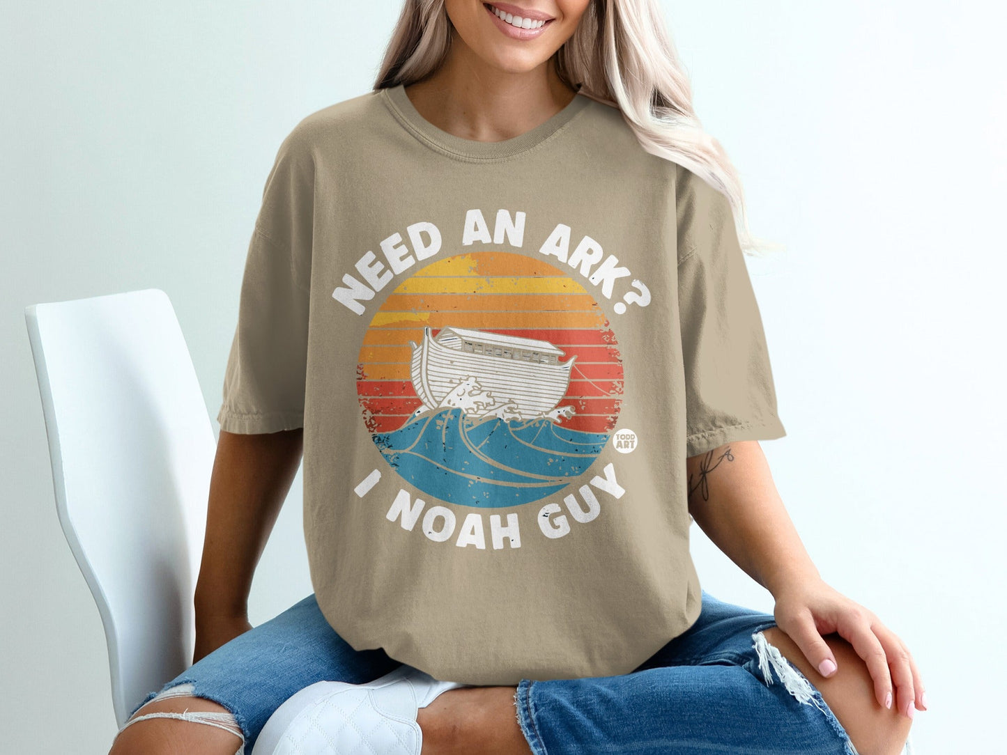 T-shirt with "Need an Ark? I Noah Guy" text and Noah's Ark on waves.