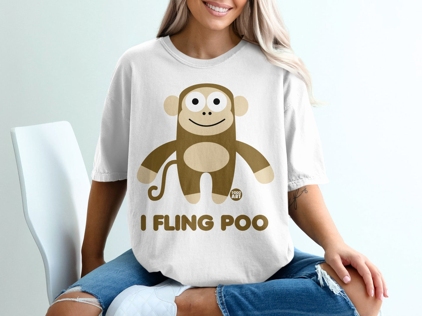 White t-shirt with a cartoon monkey and the text "I FLING POO".