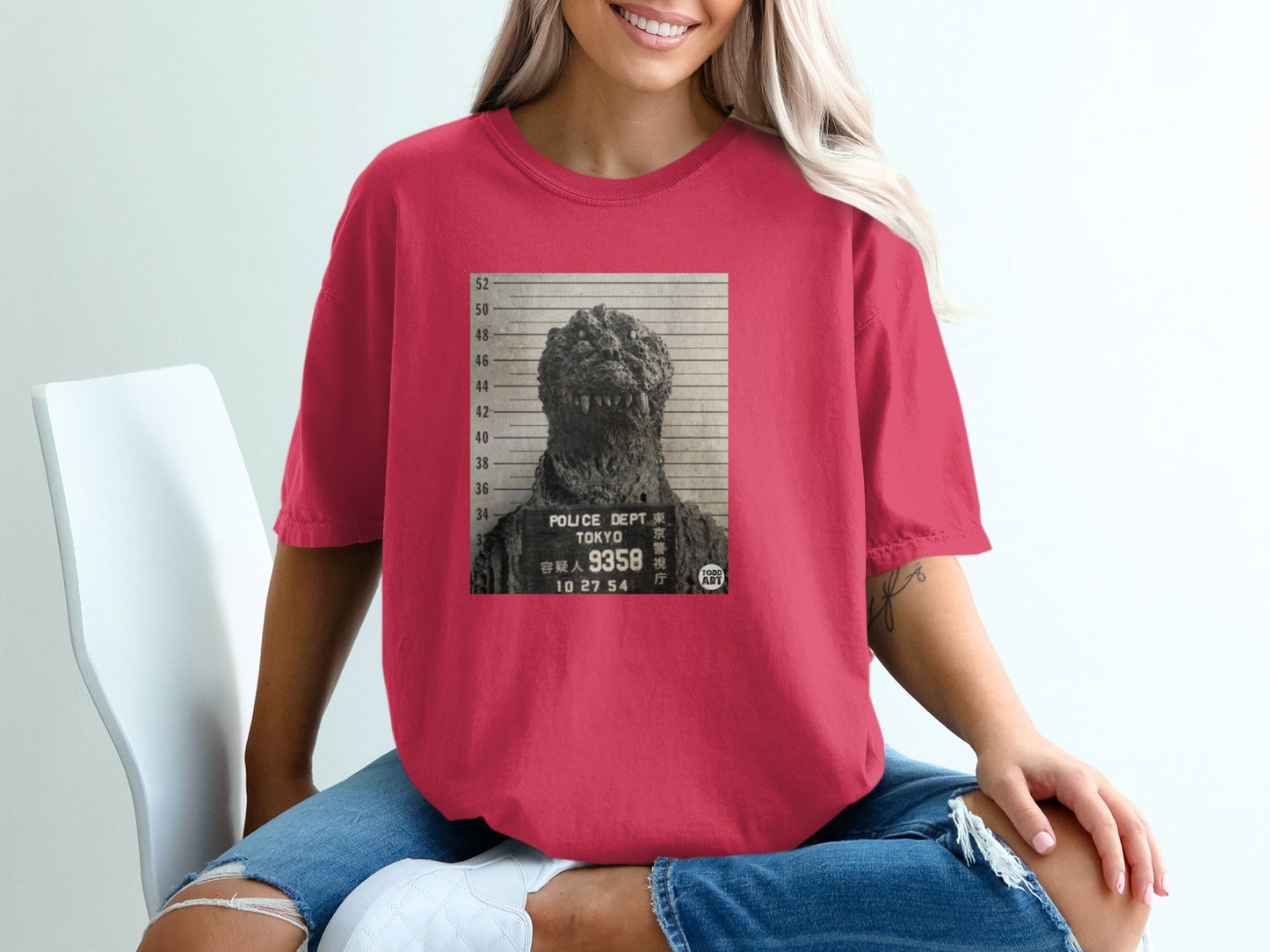 Godzilla mugshot graphic on a red crewneck t-shirt with Tokyo Police Dept. text.