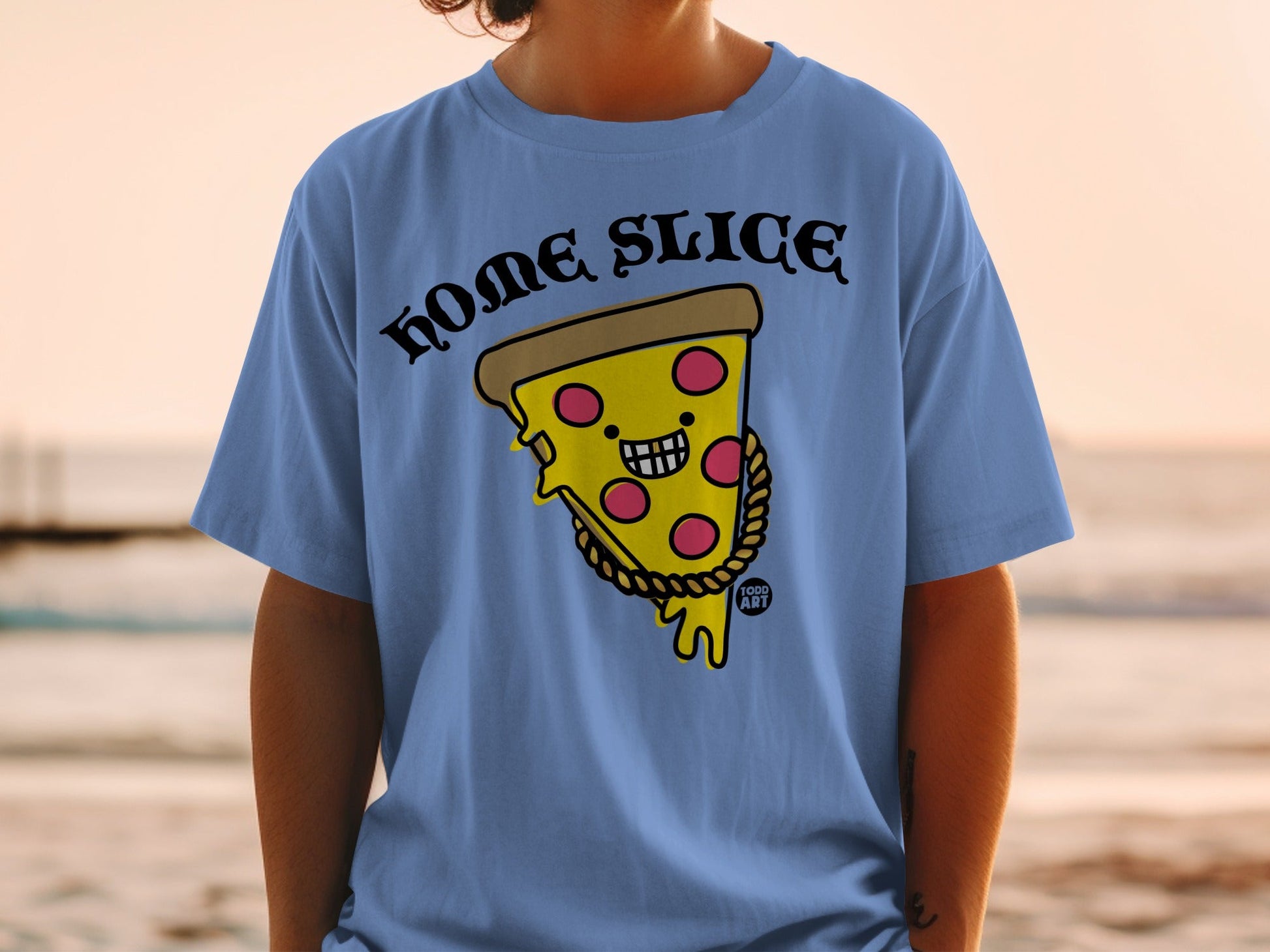 Blue t-shirt with a smiling pizza slice wearing a gold chain and "HOME SLICE" text.