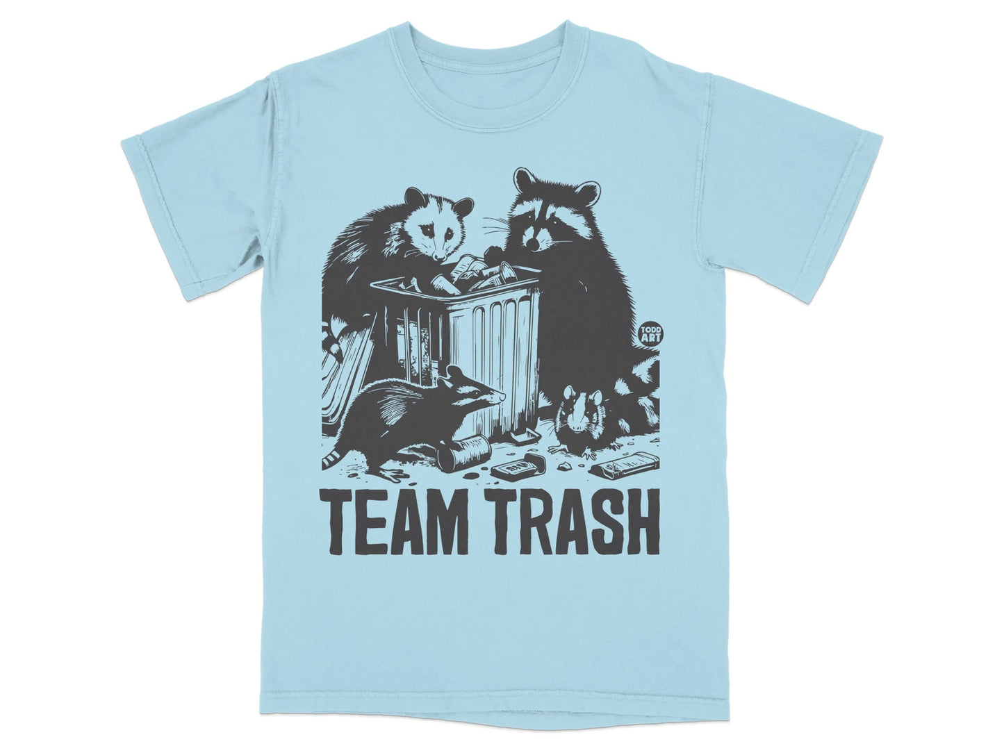 Light blue t-shirt with raccoon and opossum raiding a trash can, text "TEAM TRASH".