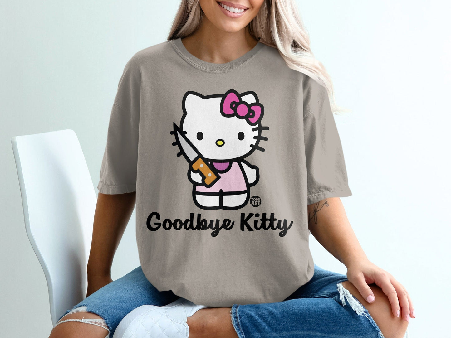 Hello Kitty graphic t-shirt with text "Goodbye Kitty" and a knife.