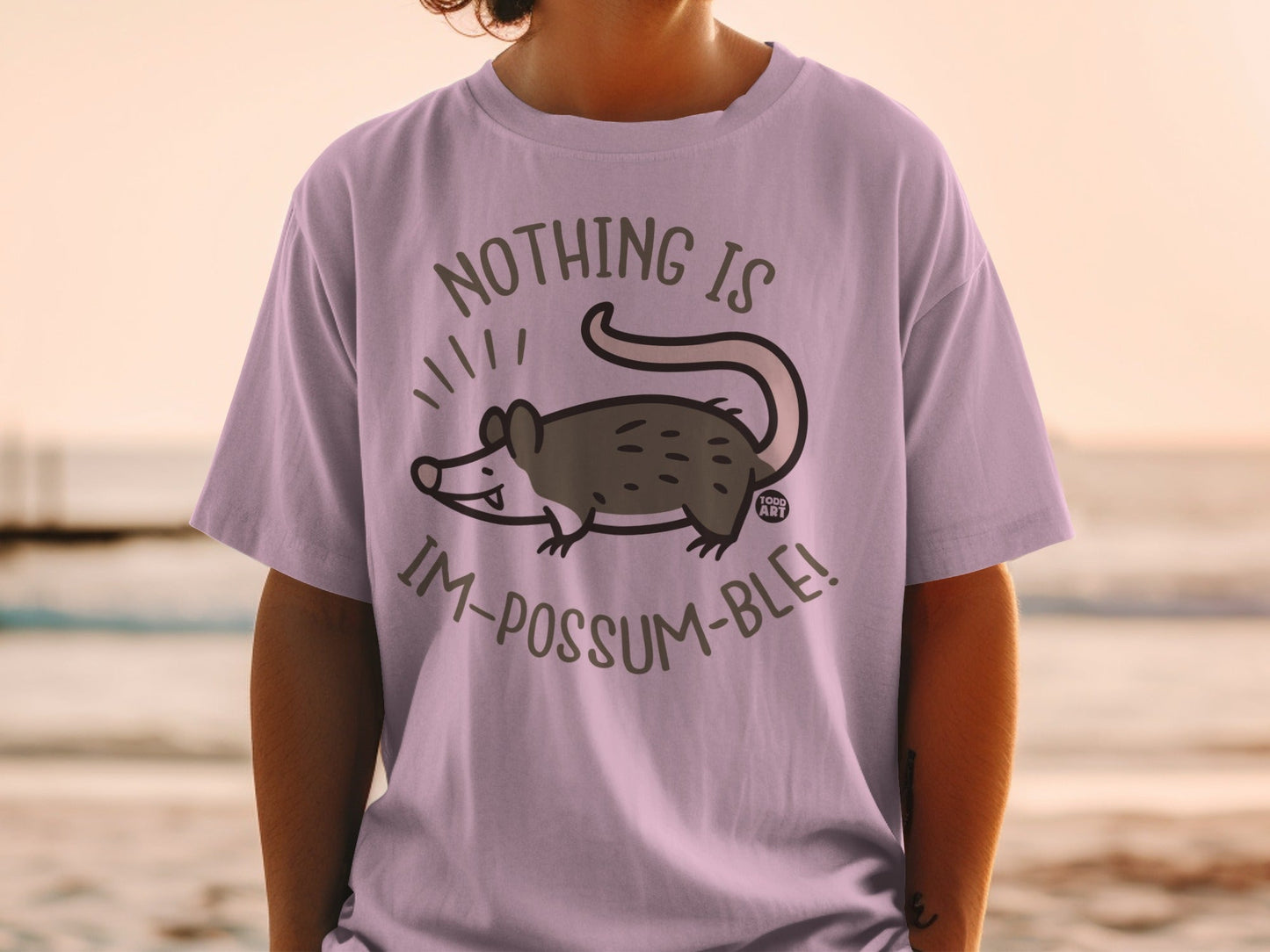 T-shirt with possum illustration and "Nothing is im-possum-ble!" text.