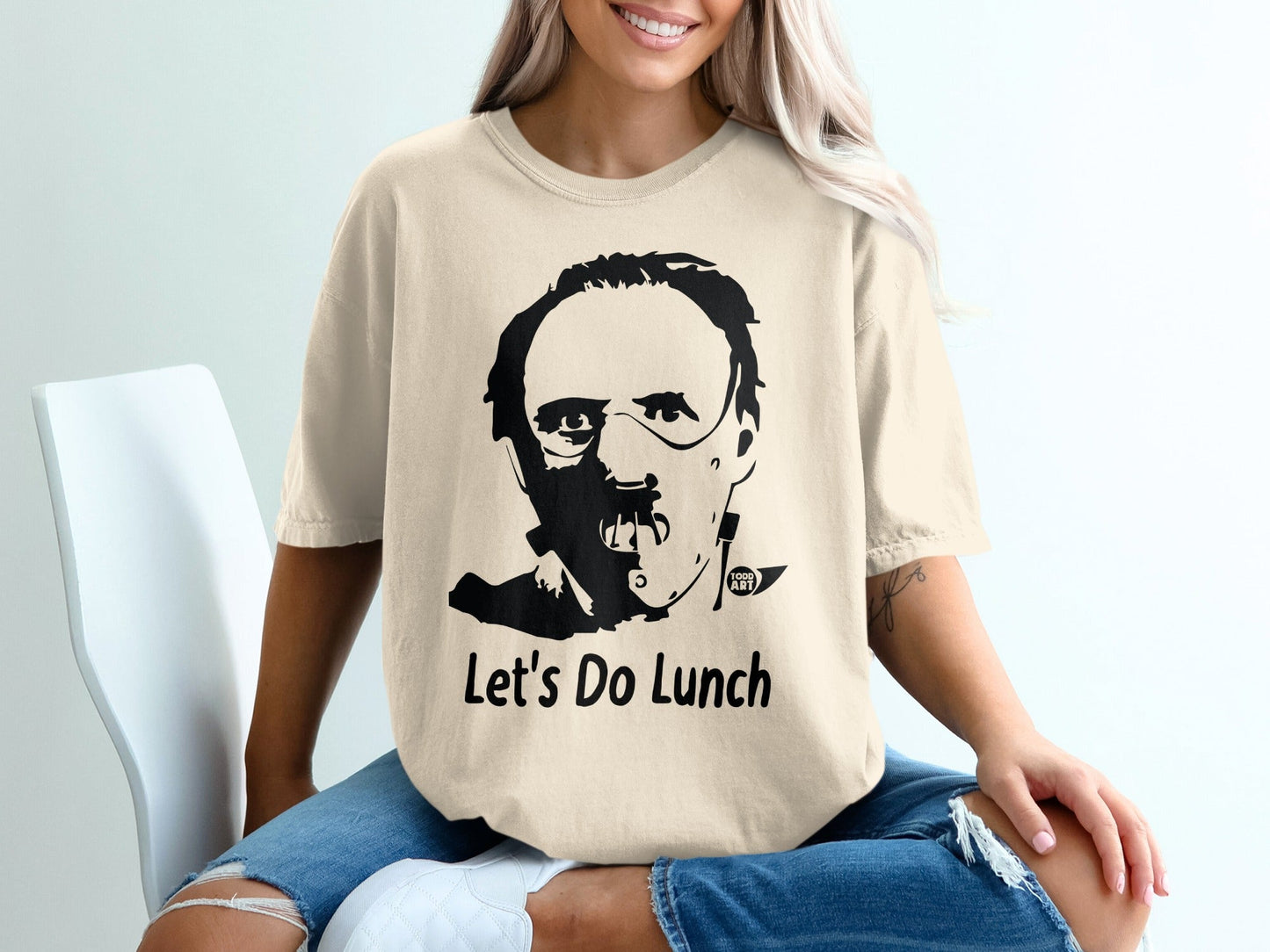 T-shirt with Hannibal Lecter mask graphic and "Let's Do Lunch" text.