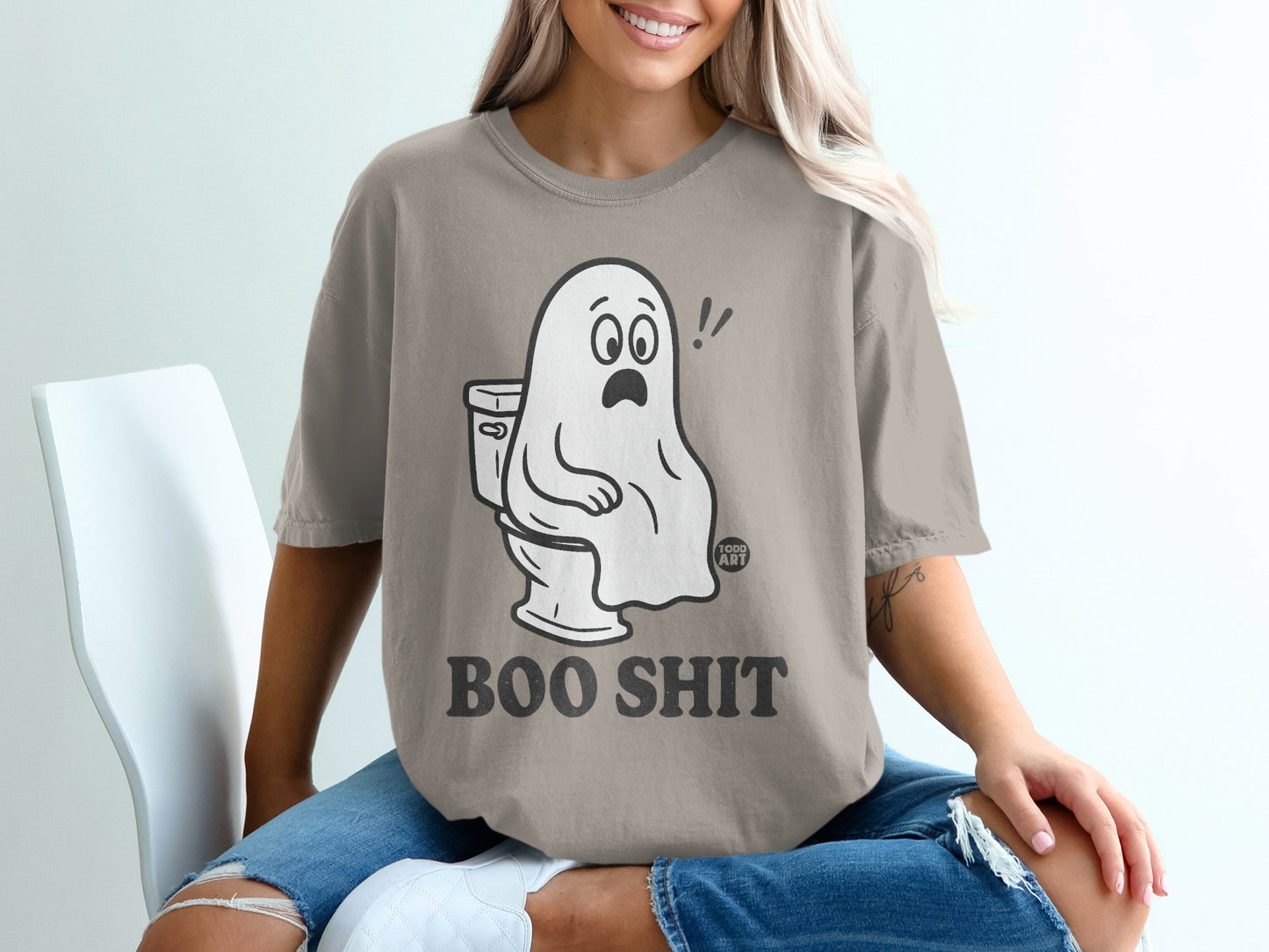 Ghost sitting on a toilet with text "BOO SHIT".