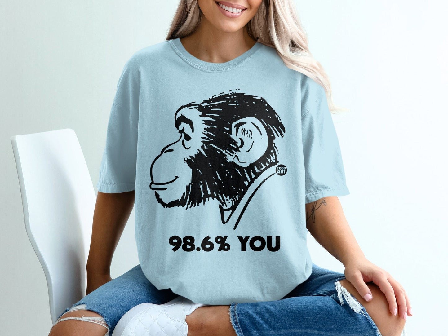 Light blue t-shirt with a chimpanzee graphic and "98.6% YOU" text.