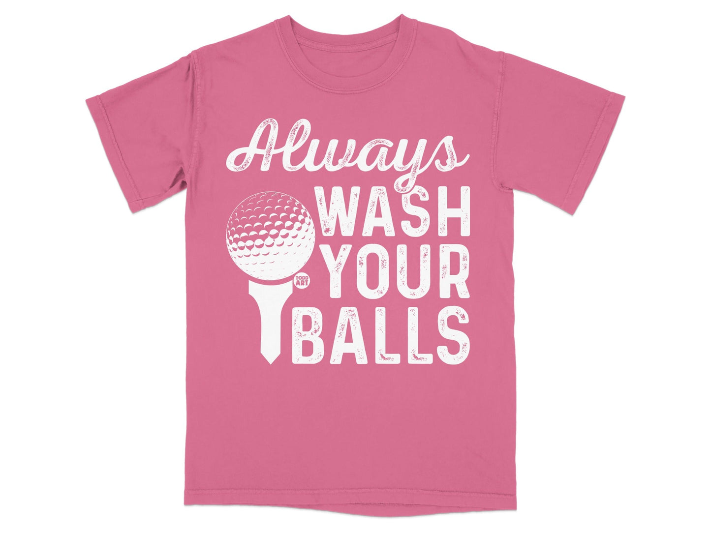 Pink t-shirt with white text and golf ball on tee: "Always Wash Your Balls".