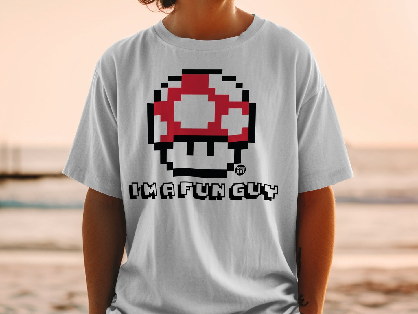 White t-shirt with Super Mario mushroom graphic and "I'M A FUN GUY" text.