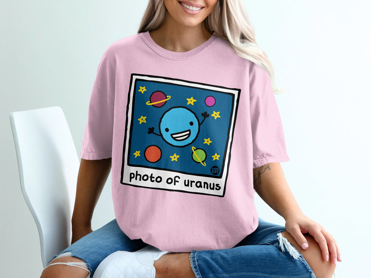 Illustration of planets in space, with the text "photo of uranus".