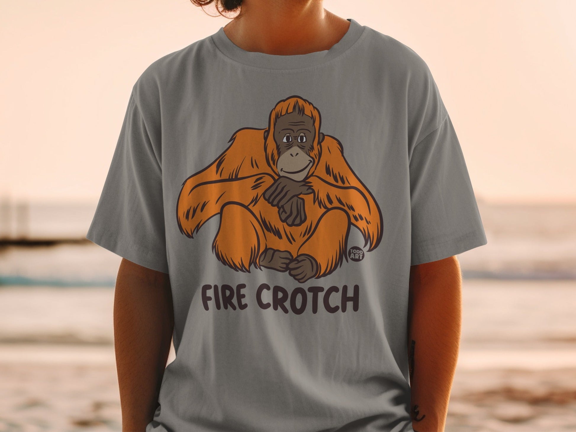 Gray t-shirt with a cartoon orangutan and "FIRE CROtch" text.