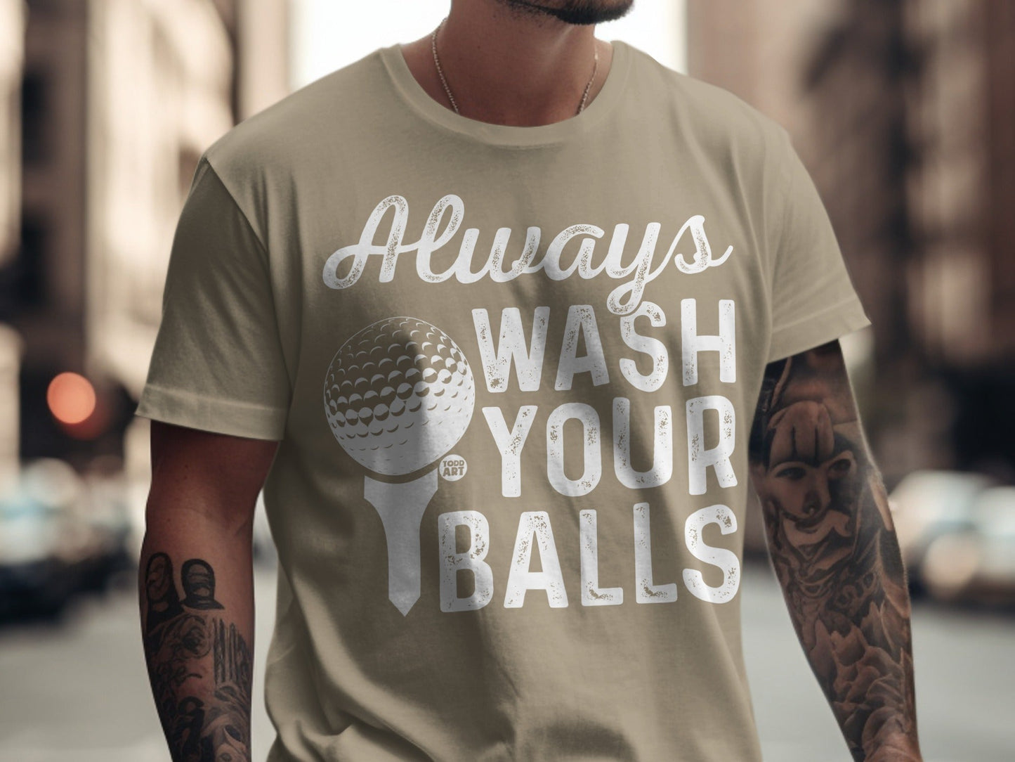 T-shirt with "Always Wash Your Balls" text and golf ball graphic.