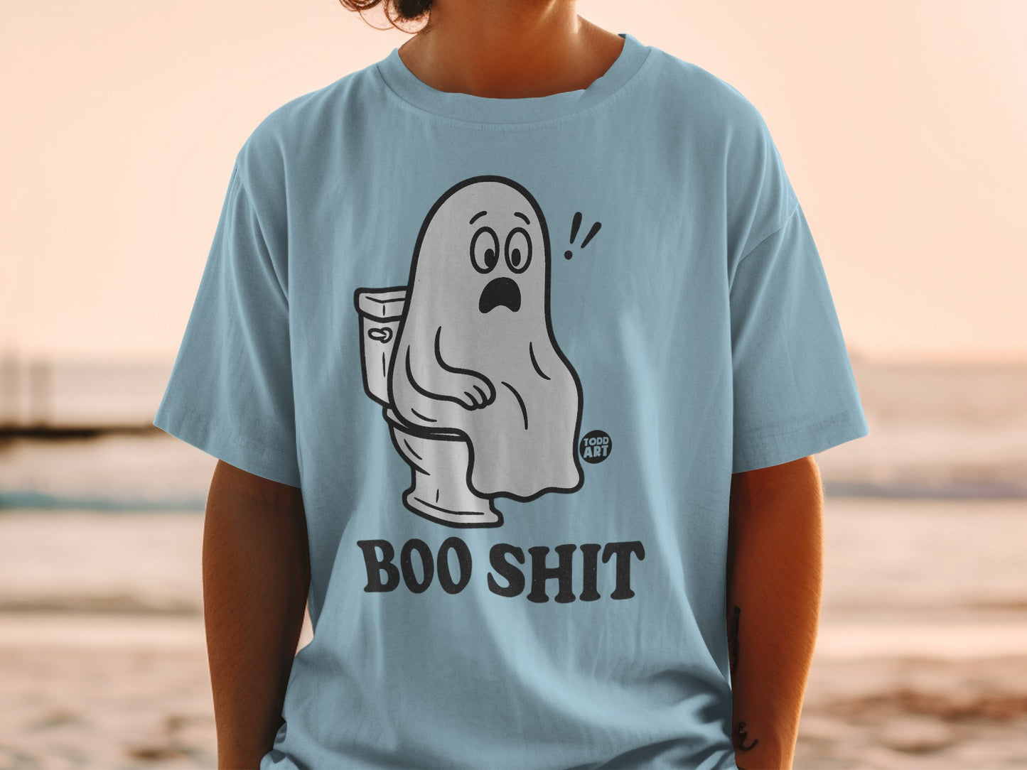 Light blue t-shirt with a cartoon ghost sitting on a toilet, text "BOO SHIT".