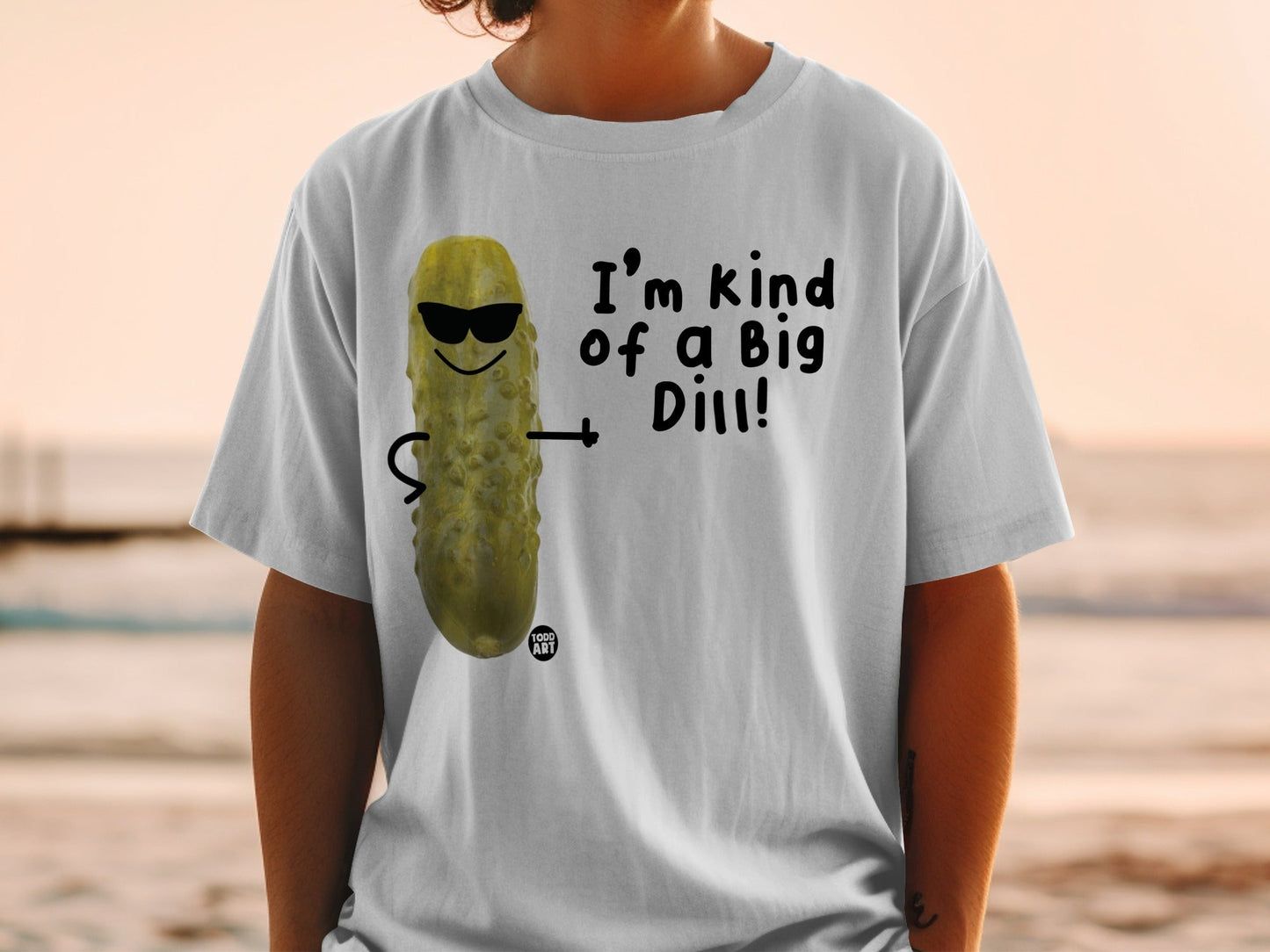 T-shirt with graphic of a pickle wearing sunglasses saying "I'm kind of a big dill!"
