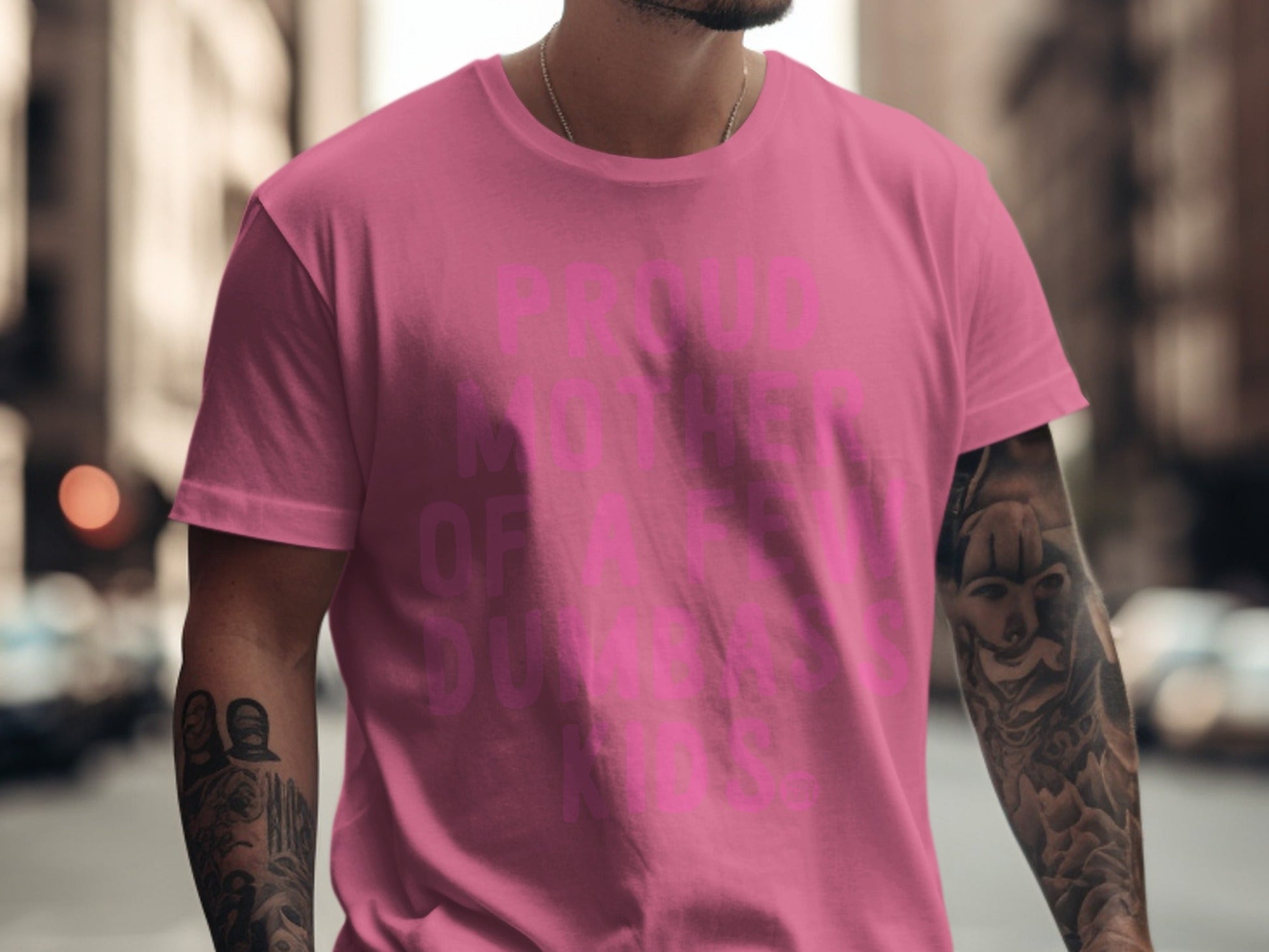 Pink t-shirt with "Proud Mother Of Assholes" text, man wearing it.