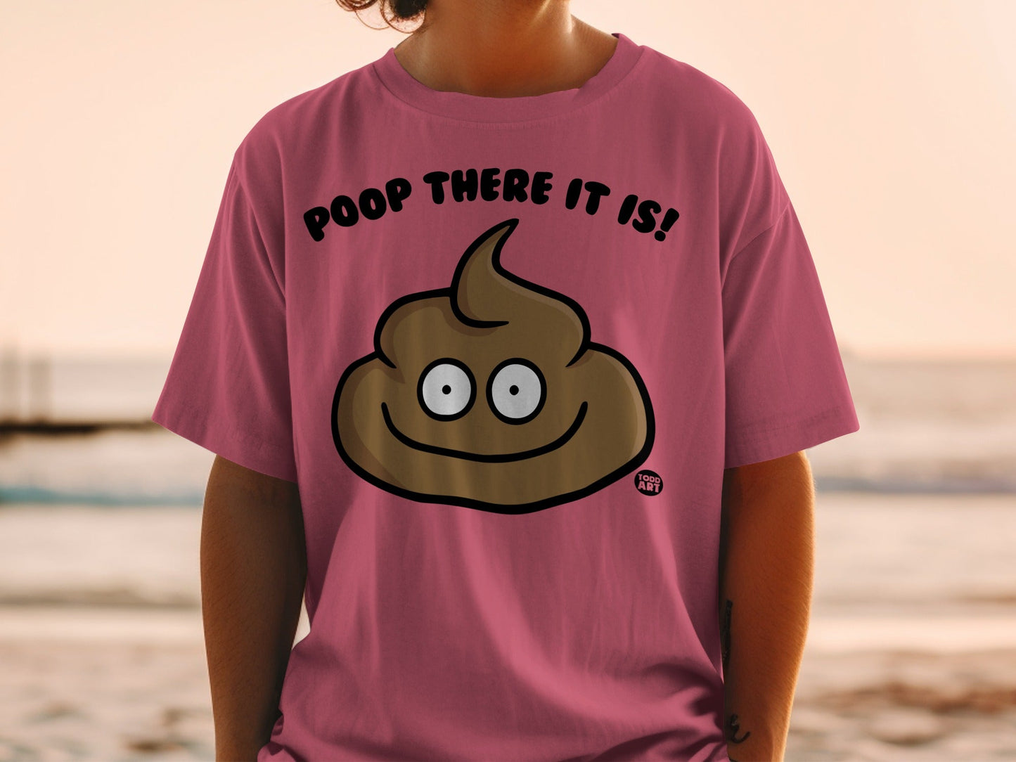 Pink t-shirt with smiling poop emoji and "Poop There It Is!" text.