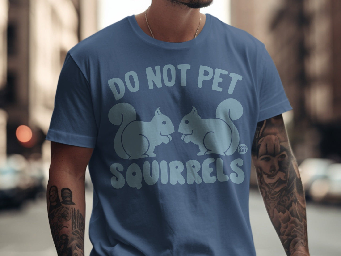 Blue t-shirt with "DO NOT PET SQUIRRELS" and two stylized squirrels.