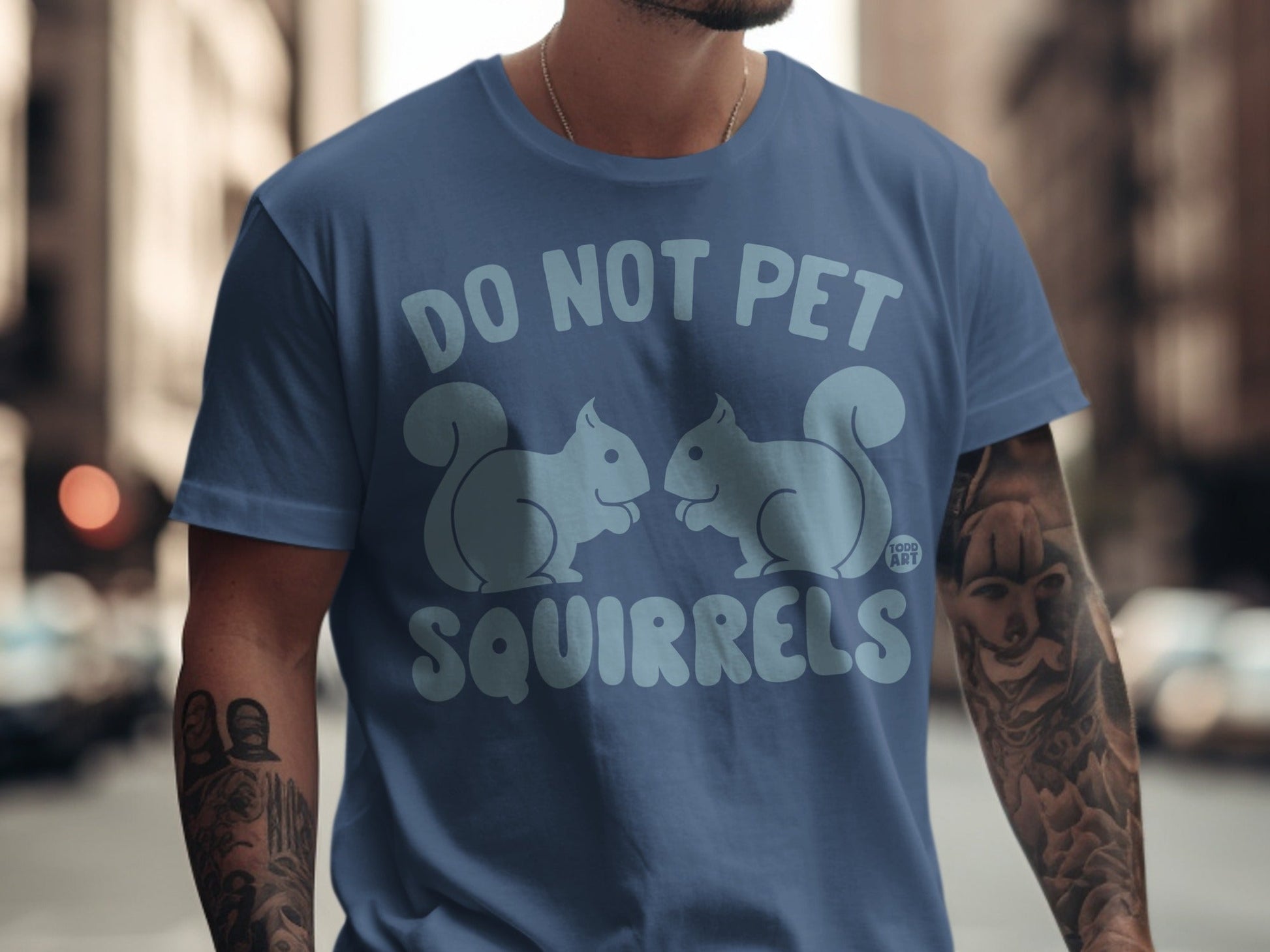 Blue t-shirt with "DO NOT PET SQUIRRELS" and two stylized squirrels.