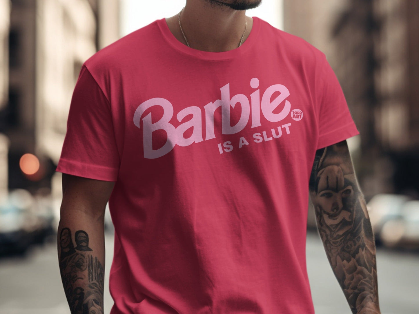 Pink t-shirt with "Barbie IS A SLUT" text and Barbie logo.