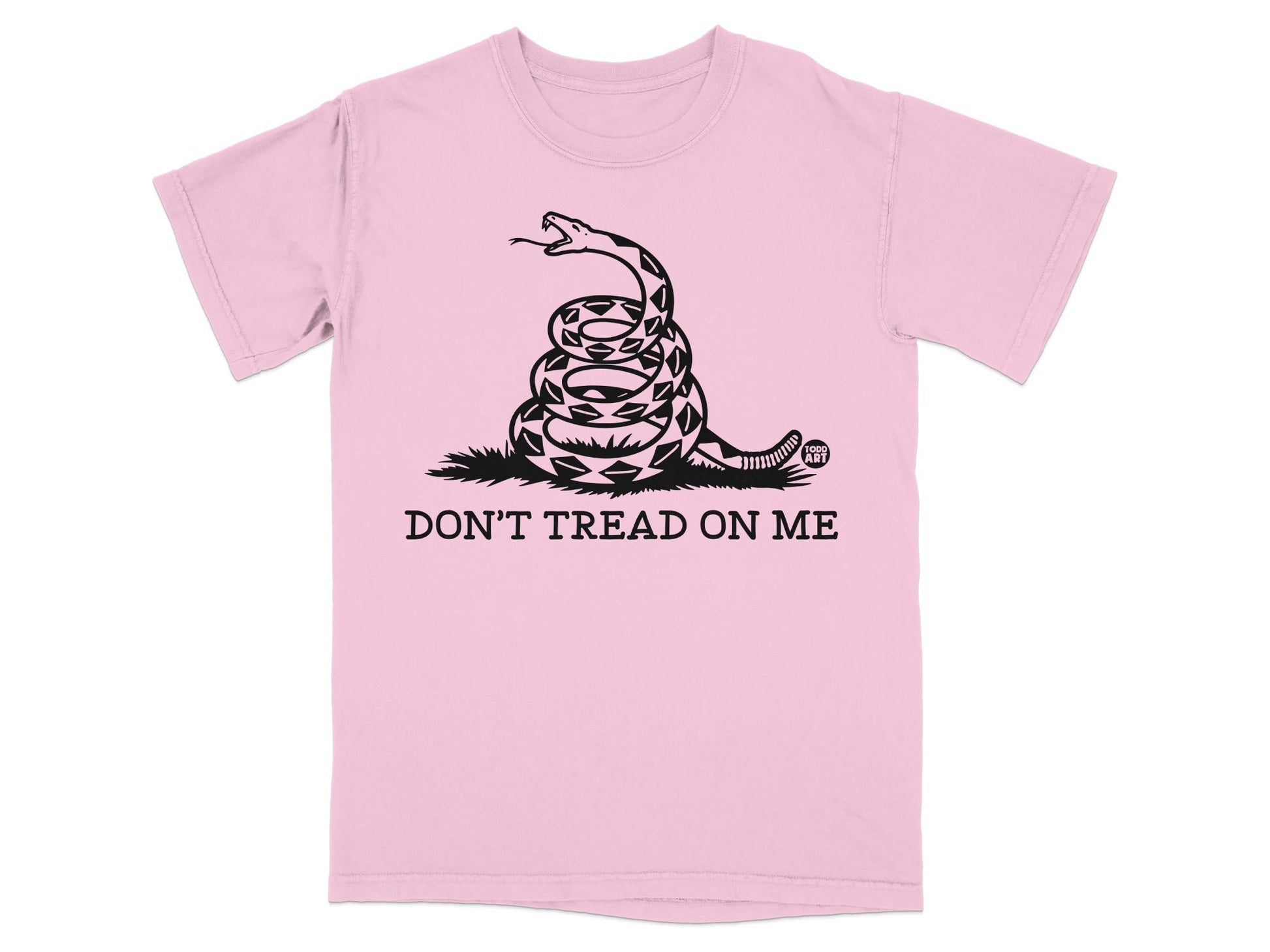 Pink t-shirt with coiled snake and "Don't Tread on Me" text.