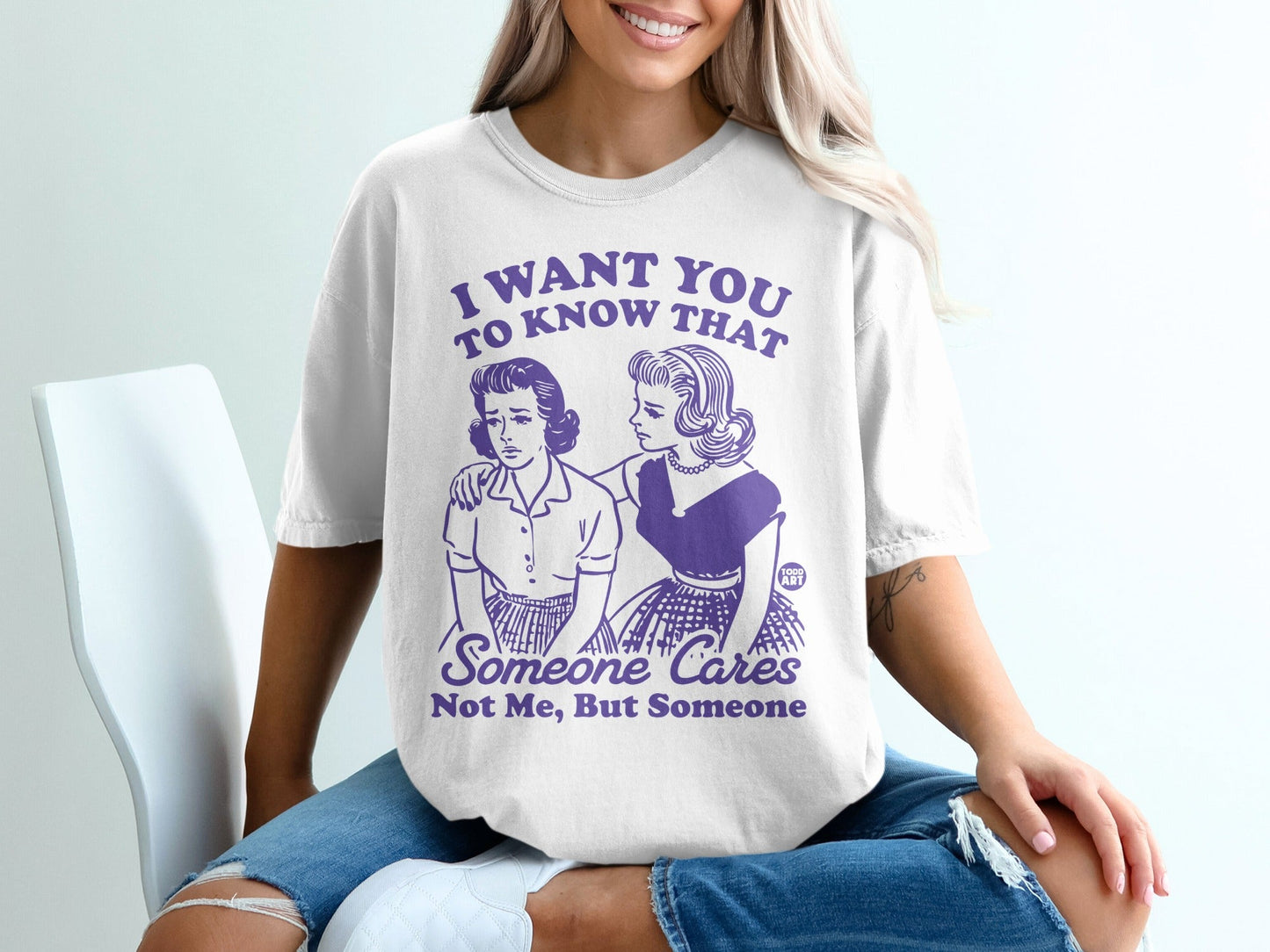 T-shirt with purple text: "I want you to know that someone cares. Not me, but someone."