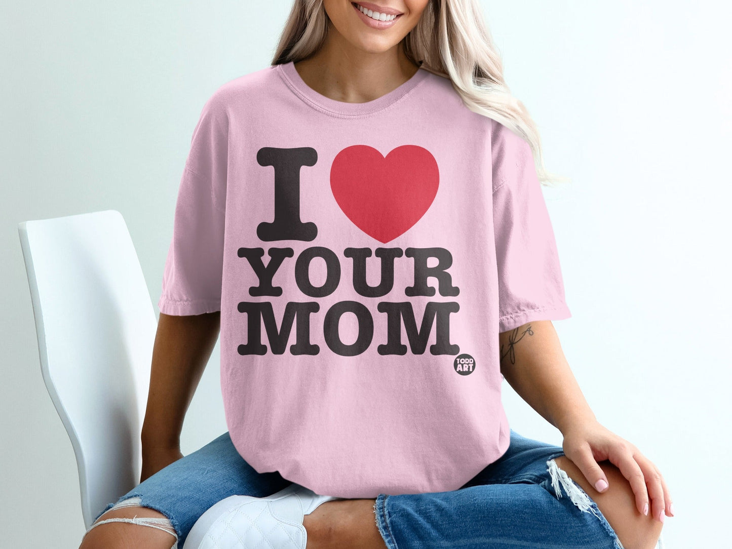 Pink t-shirt with black "I LOVE YOUR MOM" text and a red heart.
