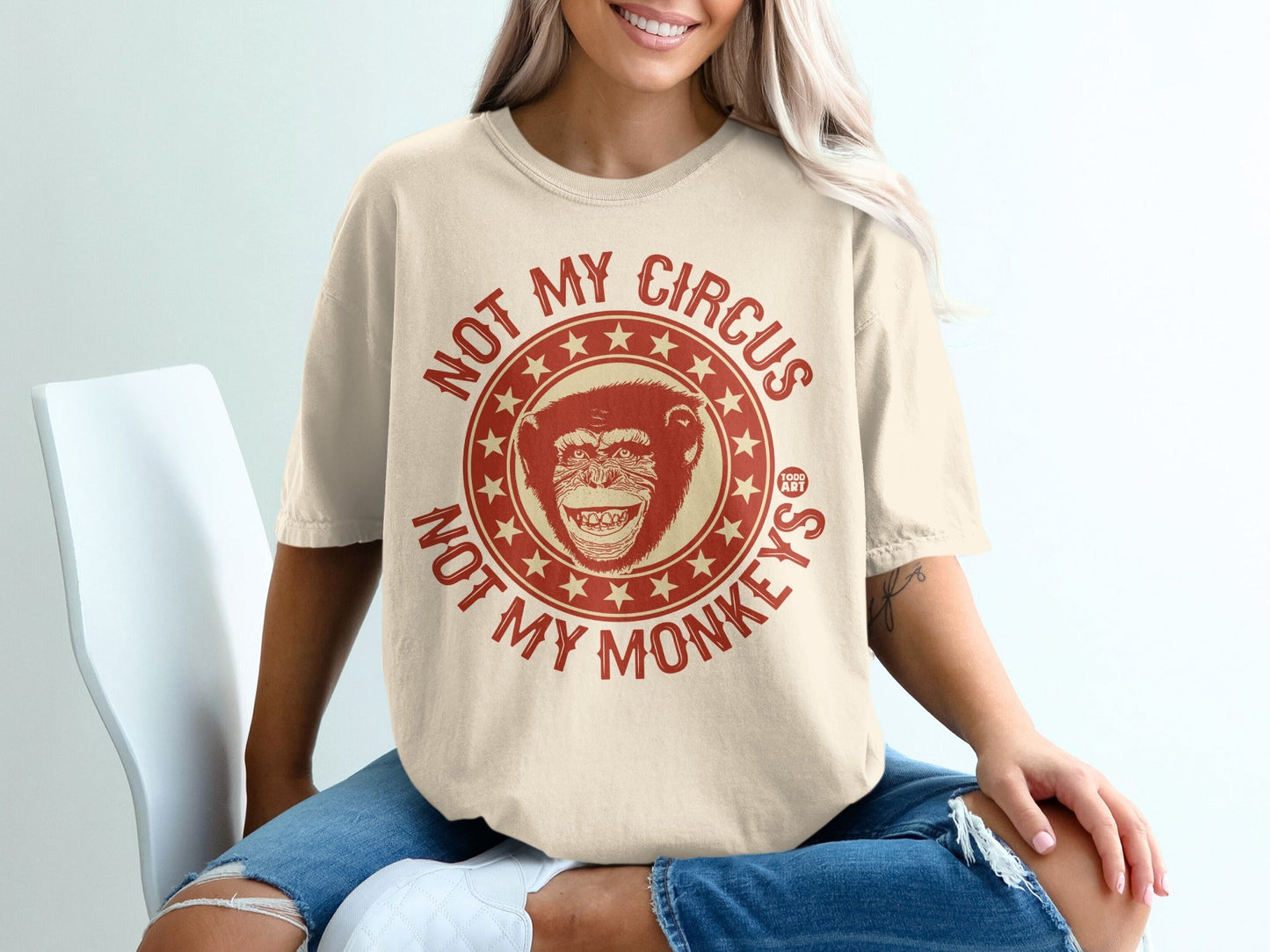 Cream graphic t-shirt with "Not My Circus Not My Monkeys" text and monkey illustration.