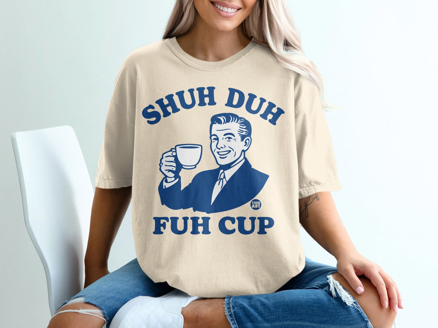 Cream t-shirt with vintage man holding a coffee cup, text "SHUH DUH FUH CUP".