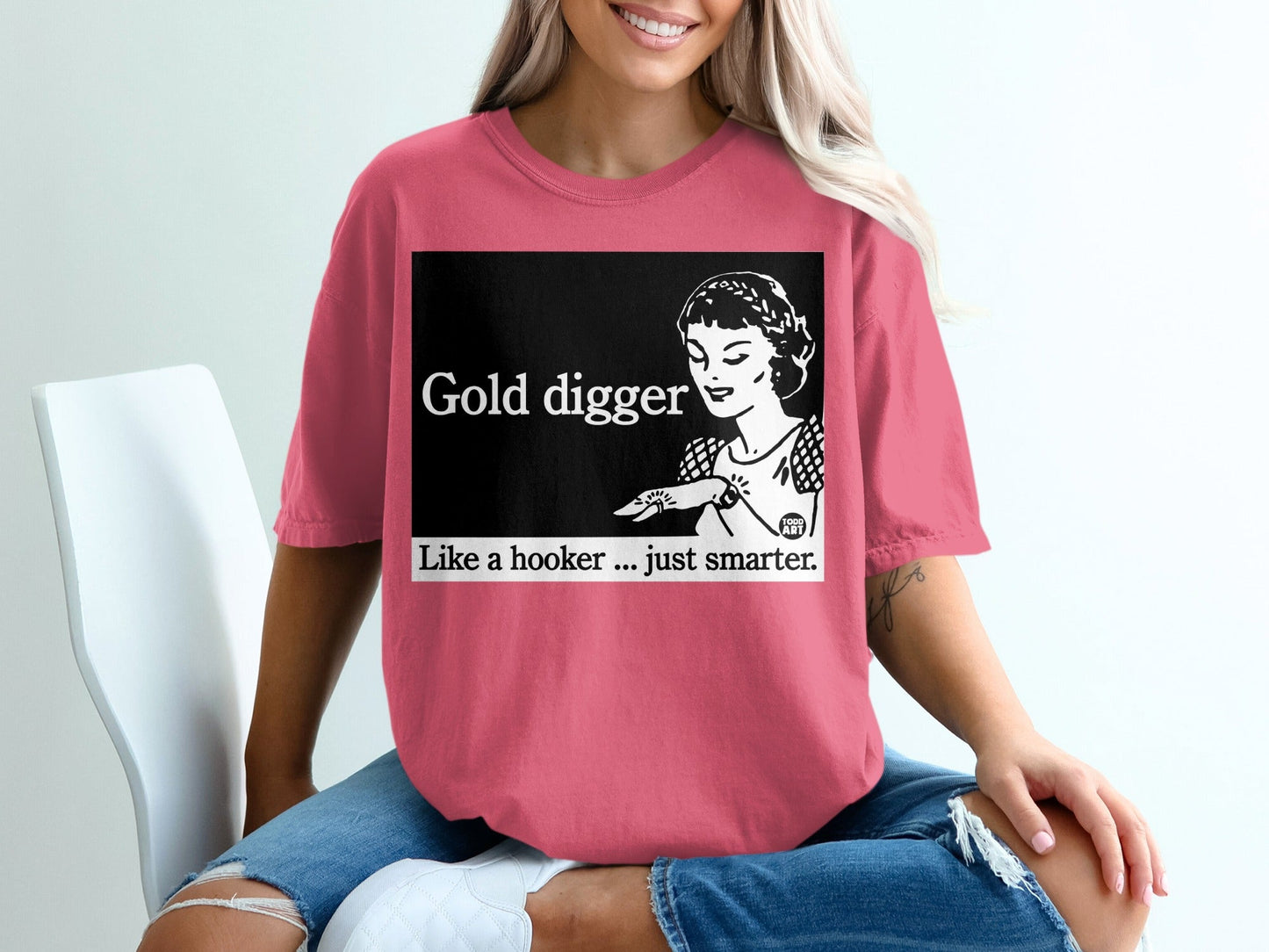 Pink t-shirt with "Gold digger Like a hooker...just smarter" graphic.