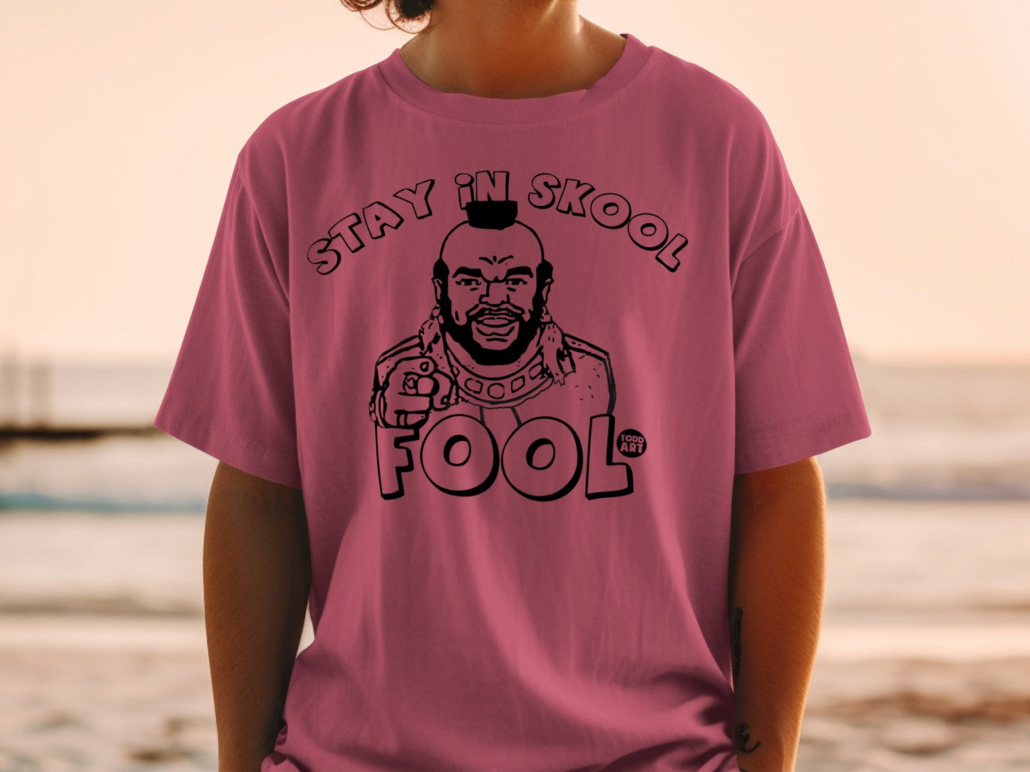 Pink t-shirt featuring Mr. T with "STAY IN SKOOL FOOL" text.