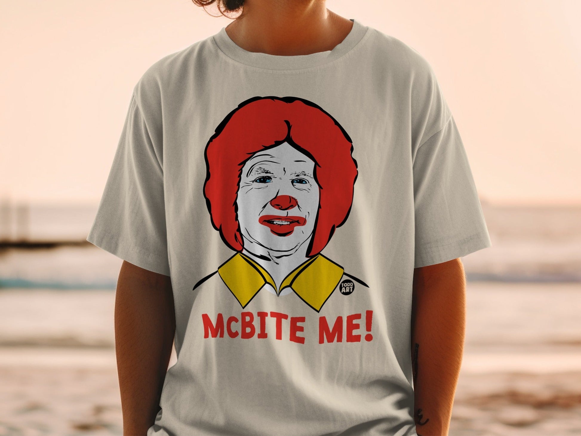 T-shirt with Ronald McDonald illustration and "MCBITE ME!" text.
