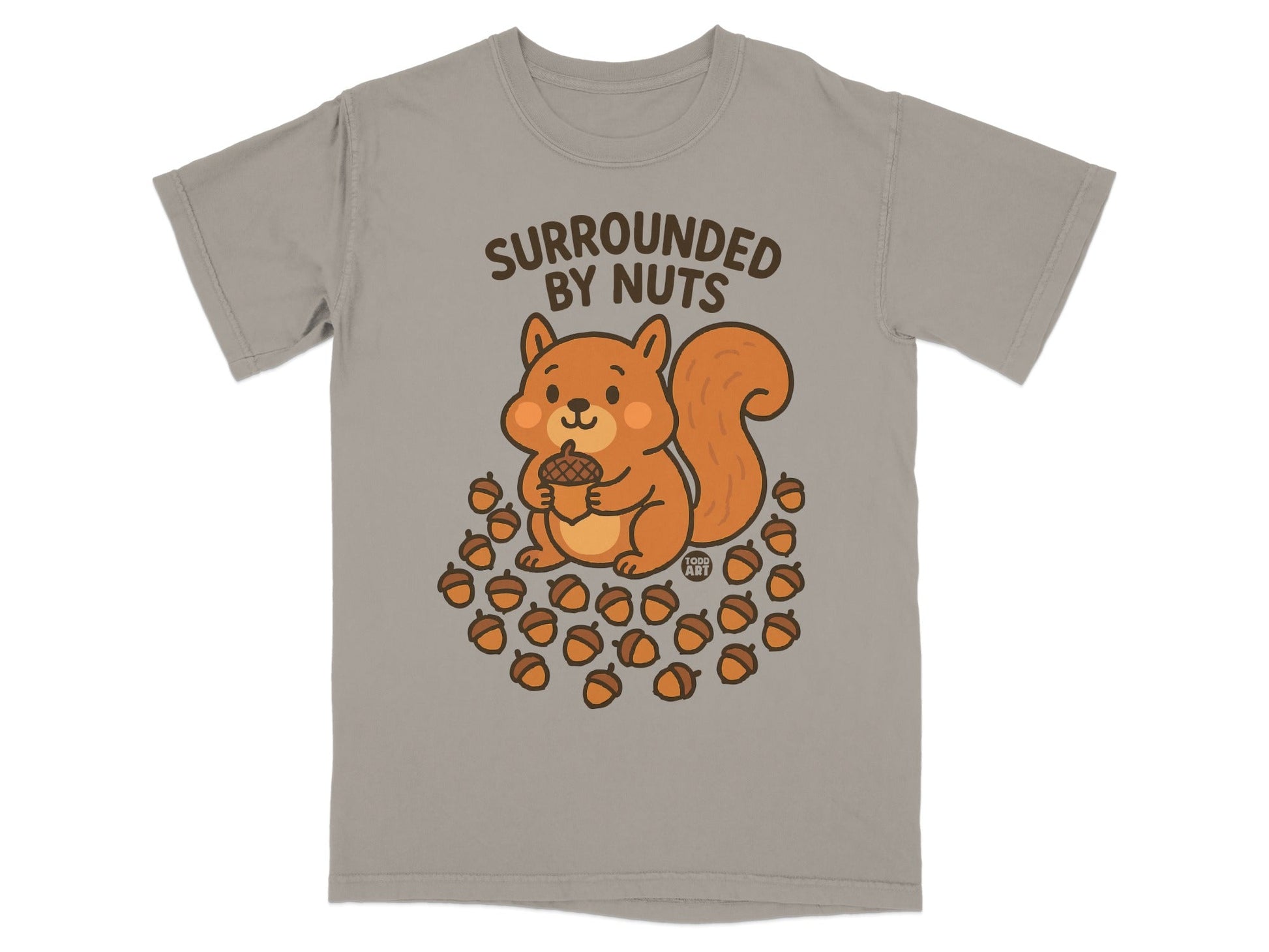 T-shirt with cartoon squirrel holding acorn surrounded by nuts.