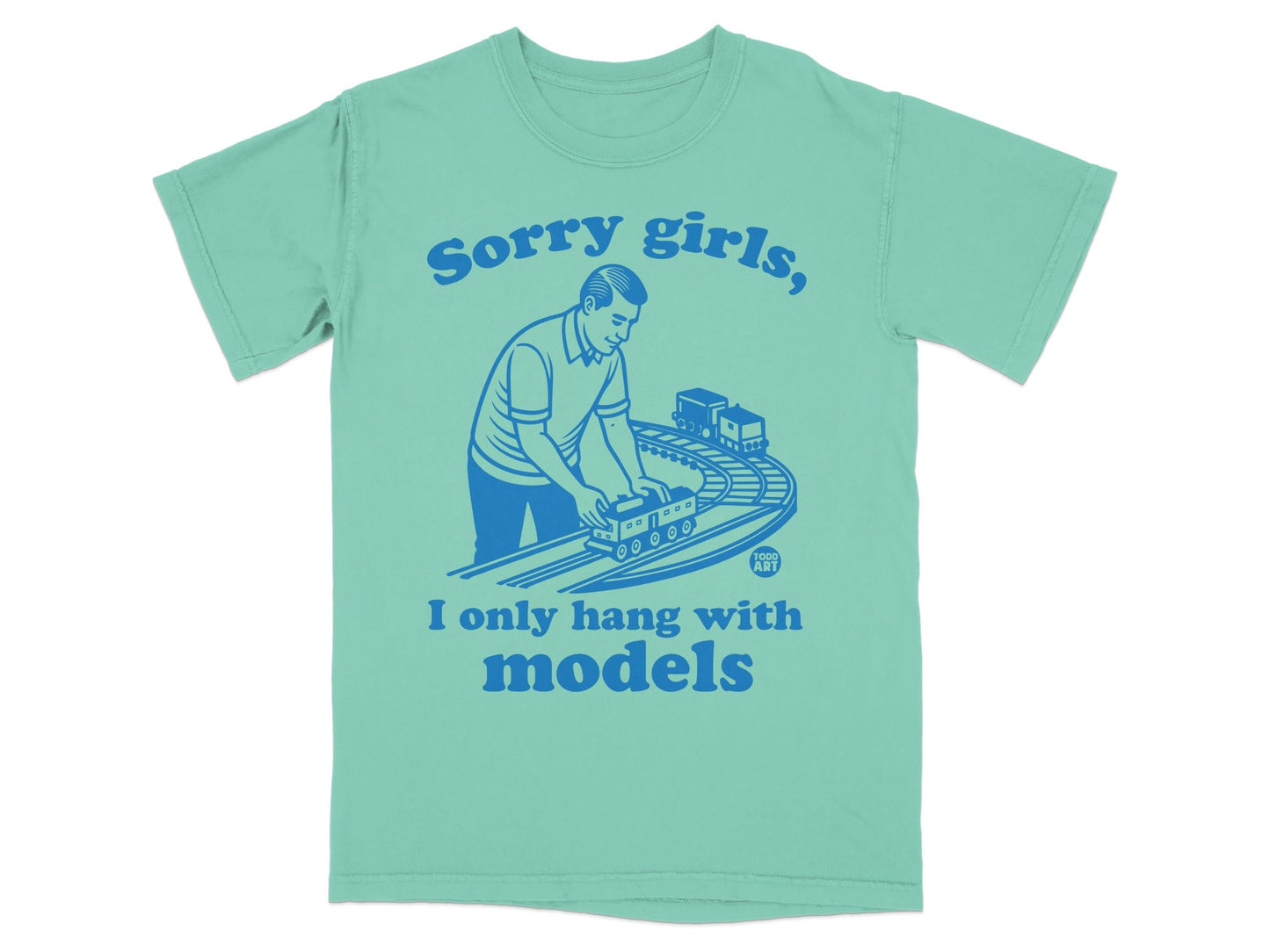 Teal t-shirt with blue graphic of man playing with model train, text "Sorry girls, I only hang with models".