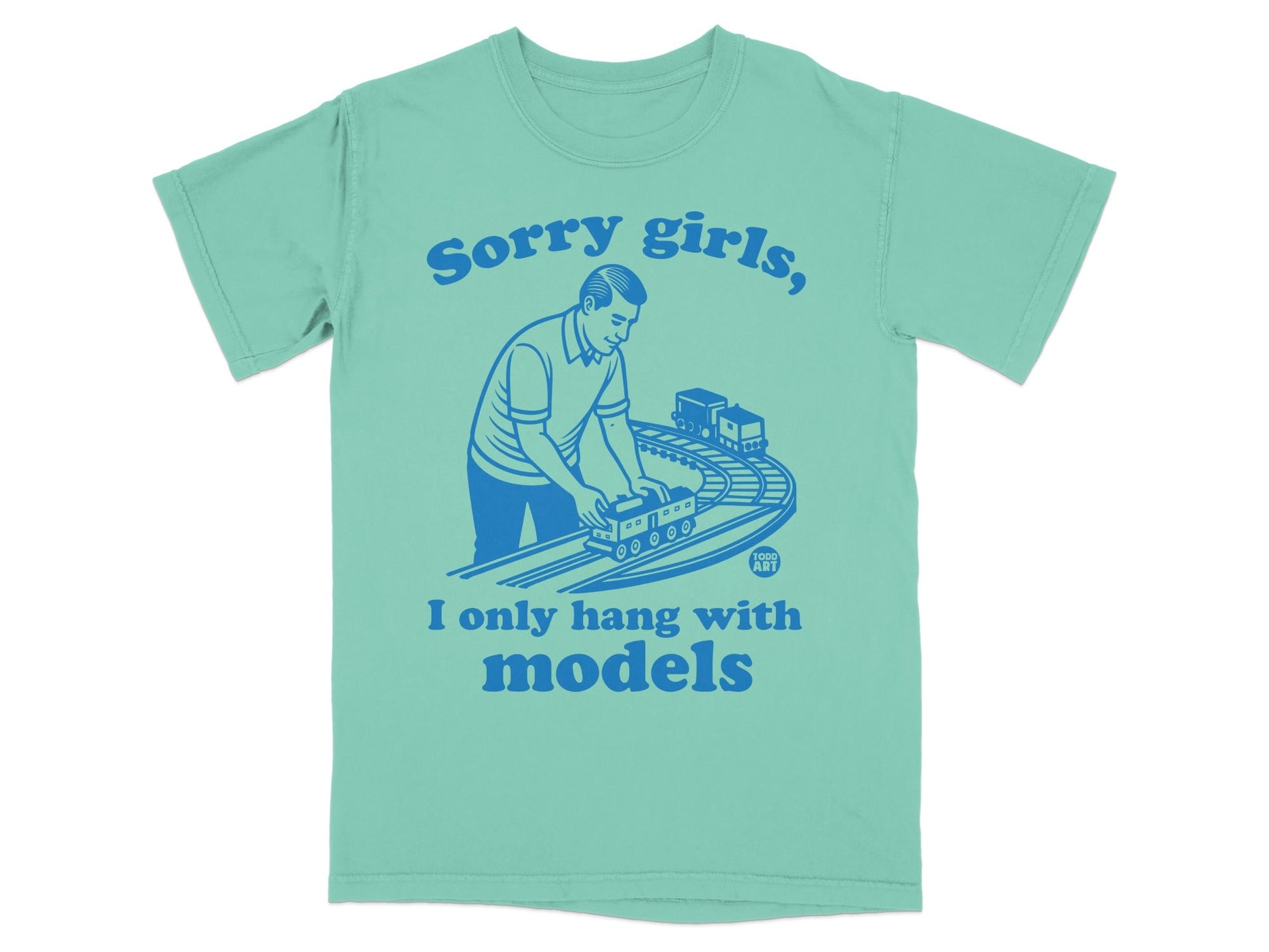 Teal t-shirt with blue graphic of man playing with model train, text "Sorry girls, I only hang with models".