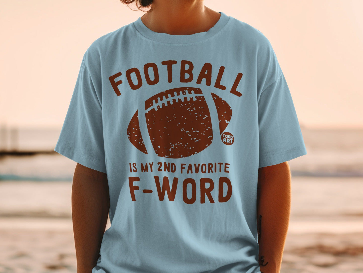 Light blue t-shirt with football graphic and "Football is my 2nd favorite F-word" text.