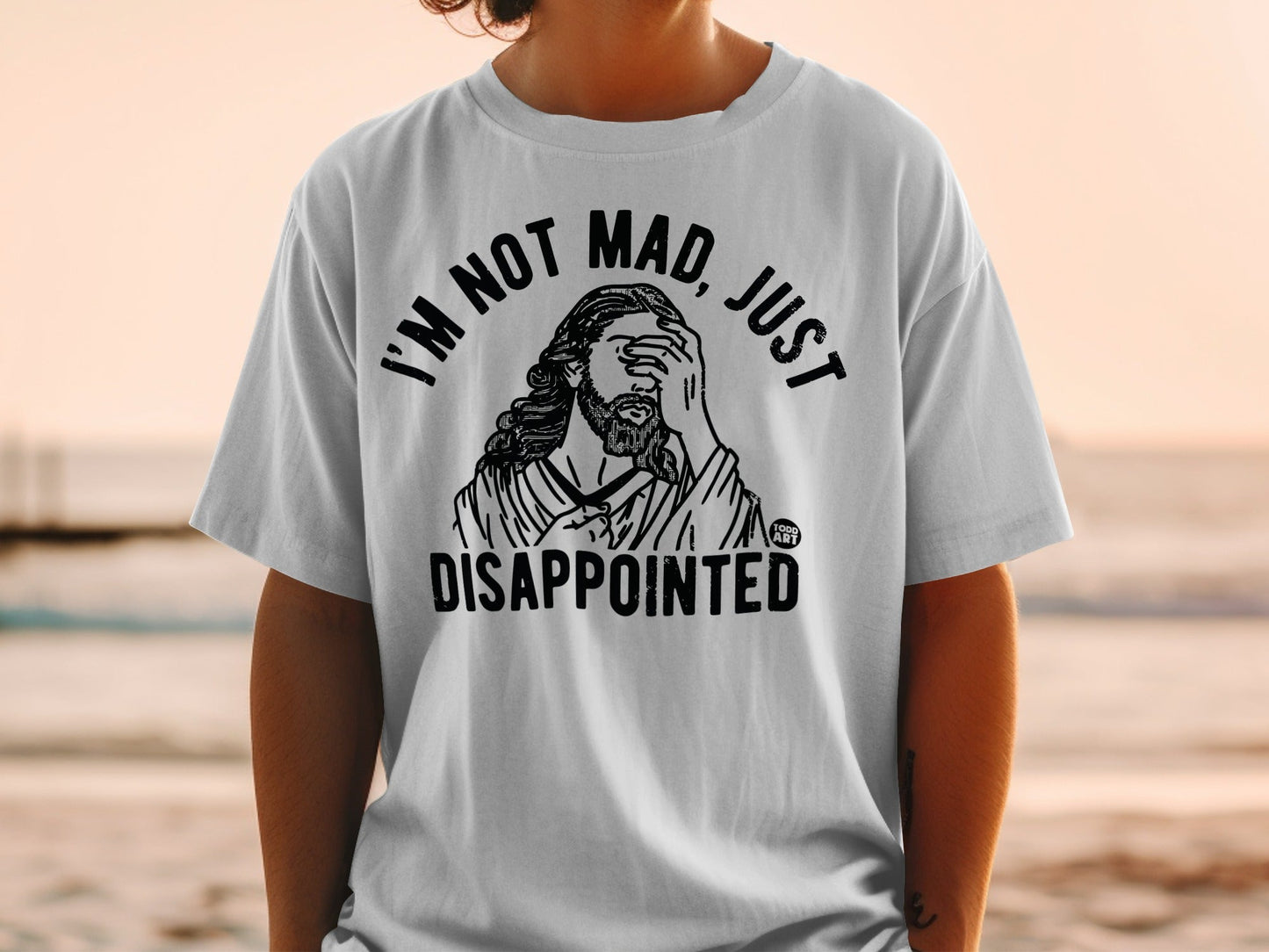 T-shirt with "I'm not mad, just disappointed" text and Jesus graphic.