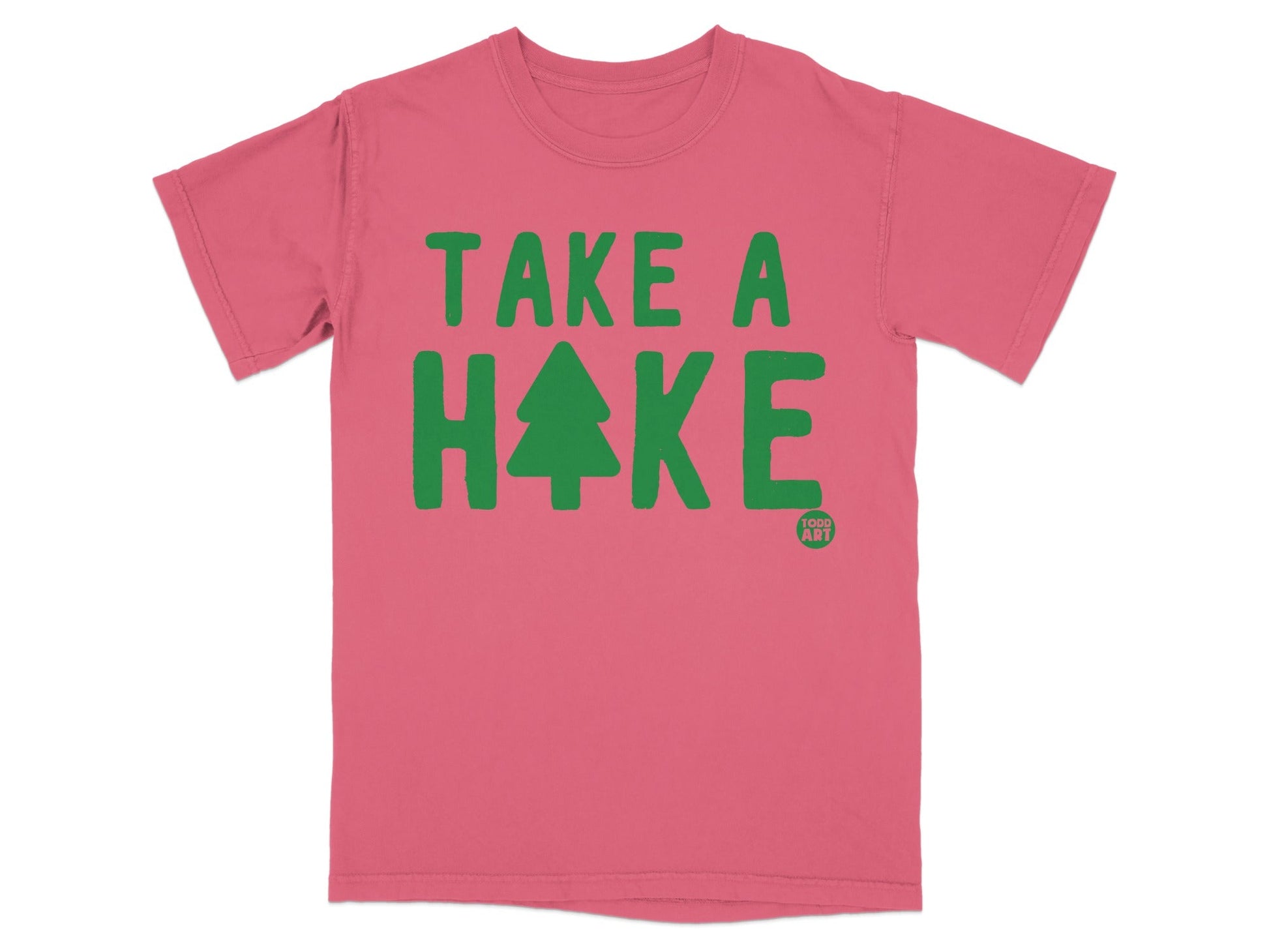 Pink t-shirt with green "TAKE A HIKE" text and a small Christmas tree graphic.