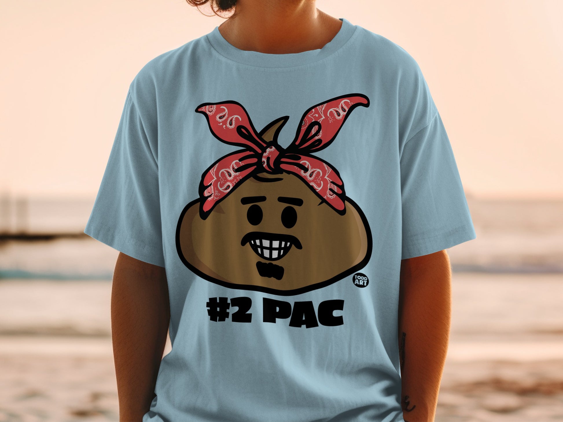 Light blue t-shirt with #2Pac cartoon emoji design.