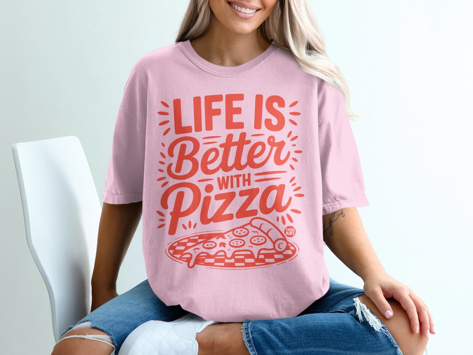 Pink t-shirt with "LIFE IS Better with Pizza" graphic featuring pizza slice.
