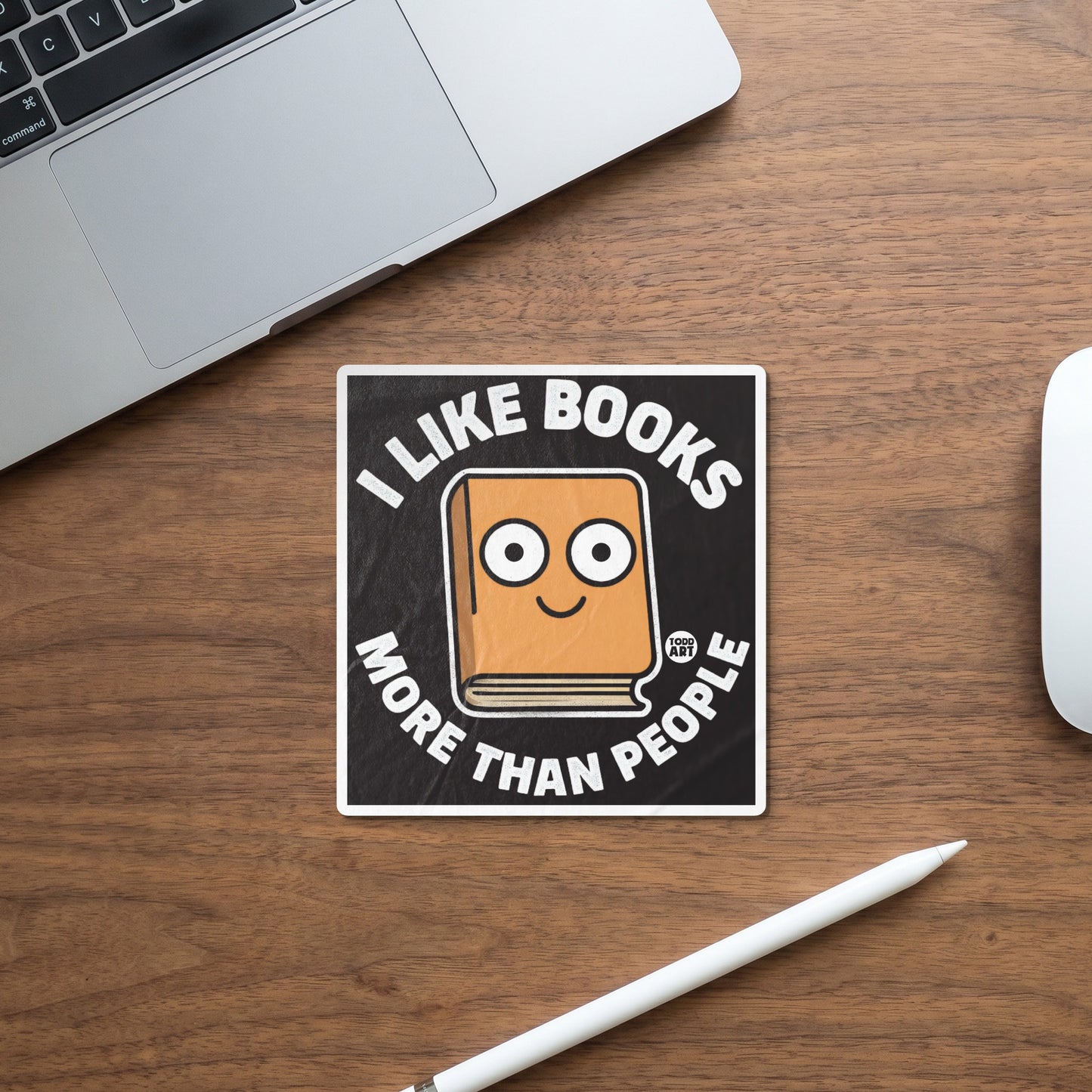 Sticker with cartoon book that says "I like books more than people."