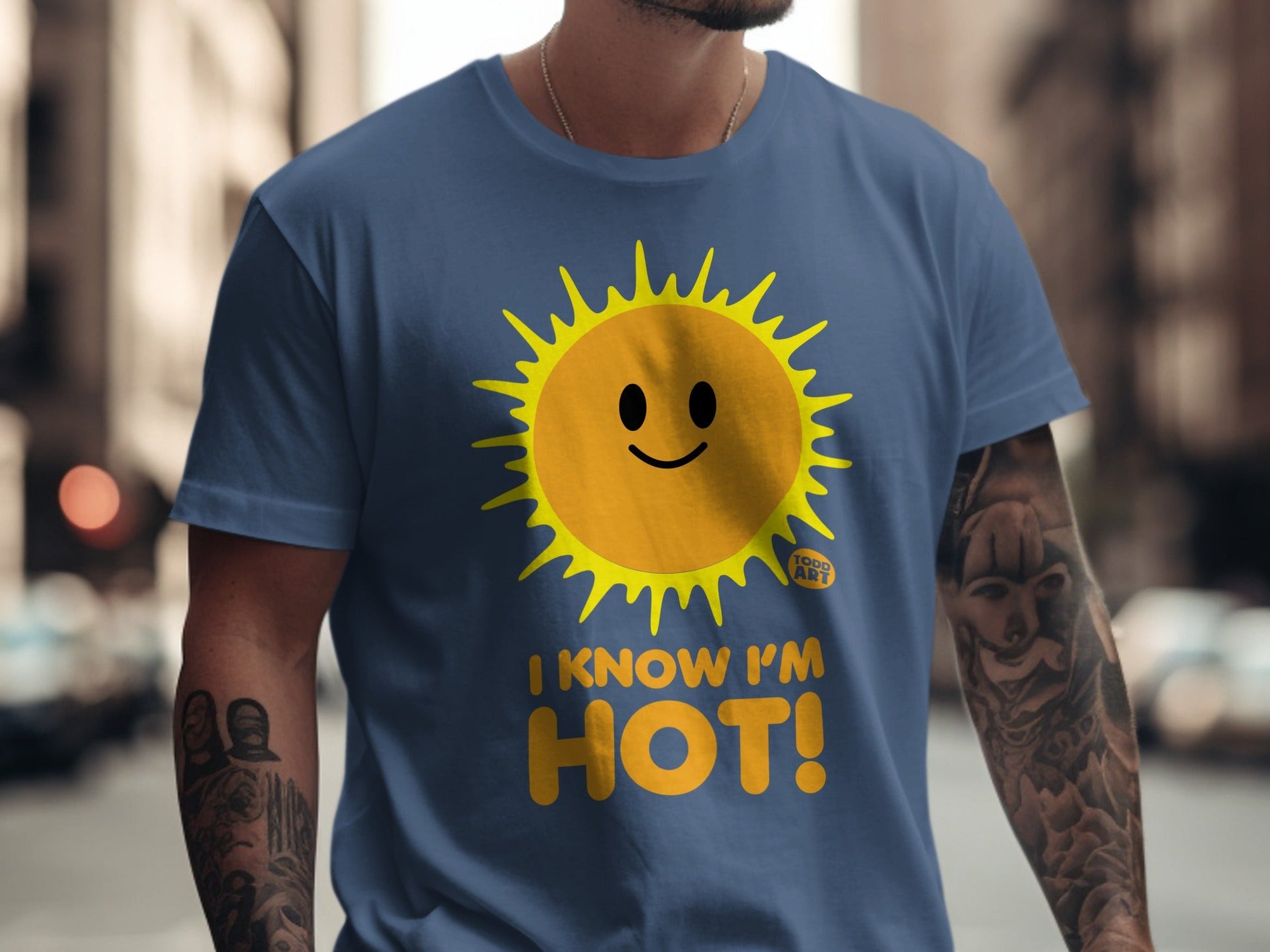 Blue t-shirt with a smiling sun graphic and the text "I KNOW I'M HOT!".
