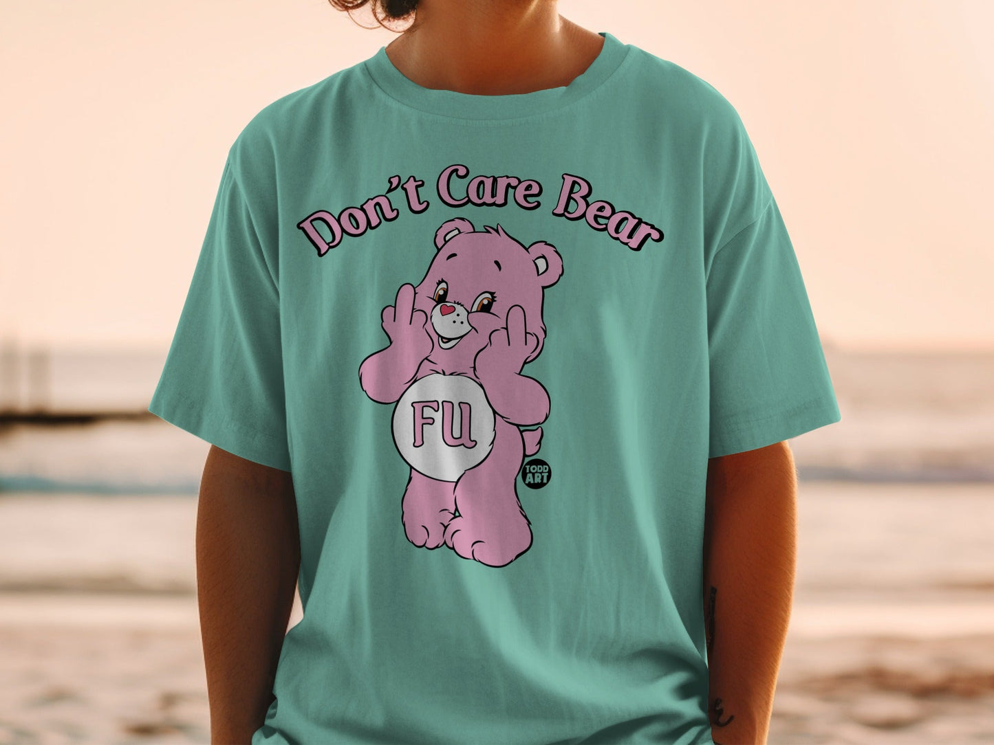 Pink Care Bear shirt with "FU" graphic and text "Don't Care Bear".