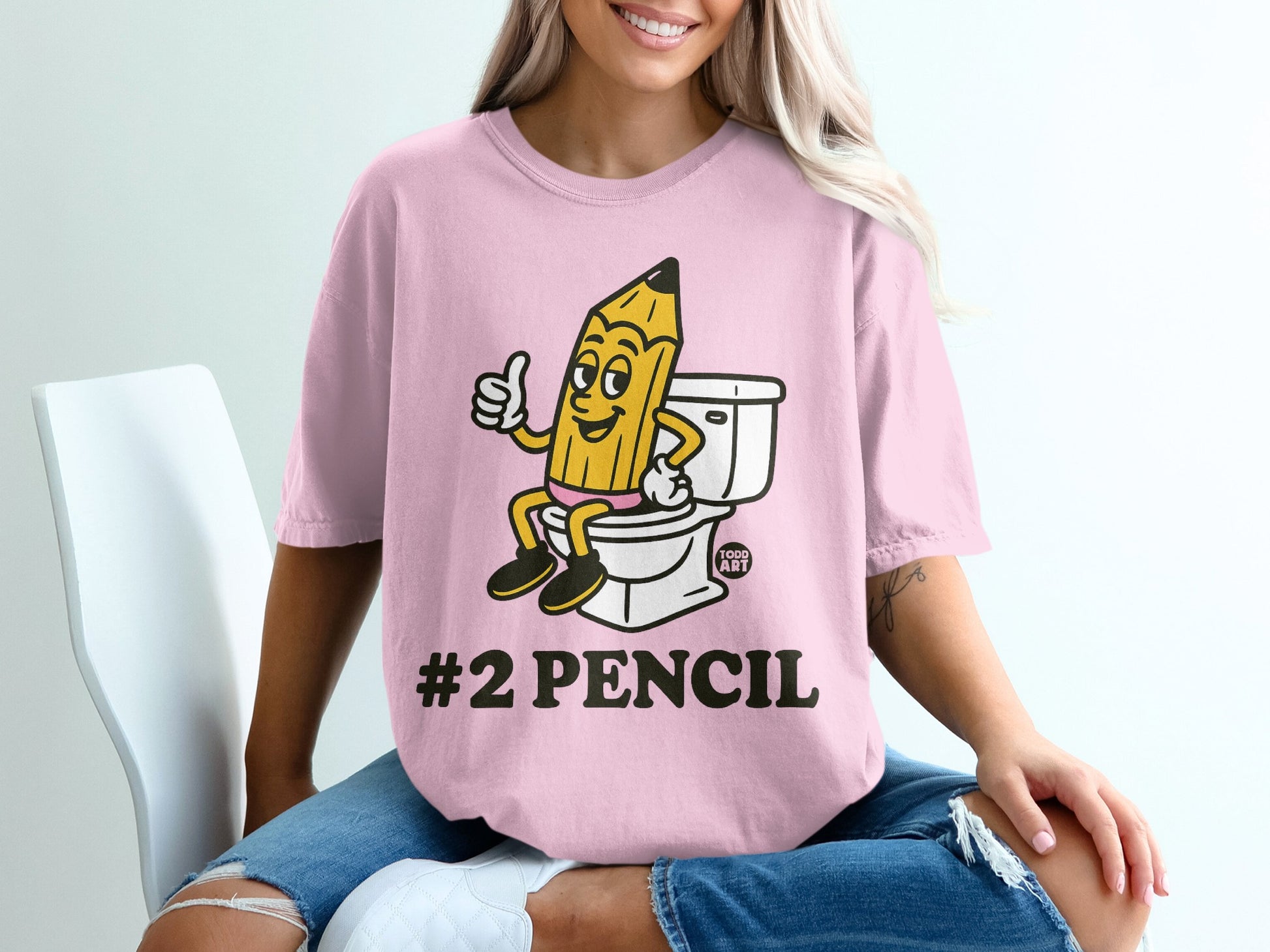Cartoon pencil giving a thumbs up on a toilet, "#2 PENCIL" text.