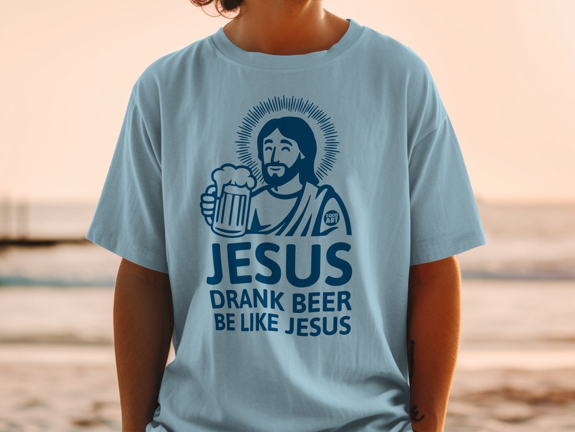 Light blue t-shirt with "Jesus Drank Beer" graphic and a beer mug.