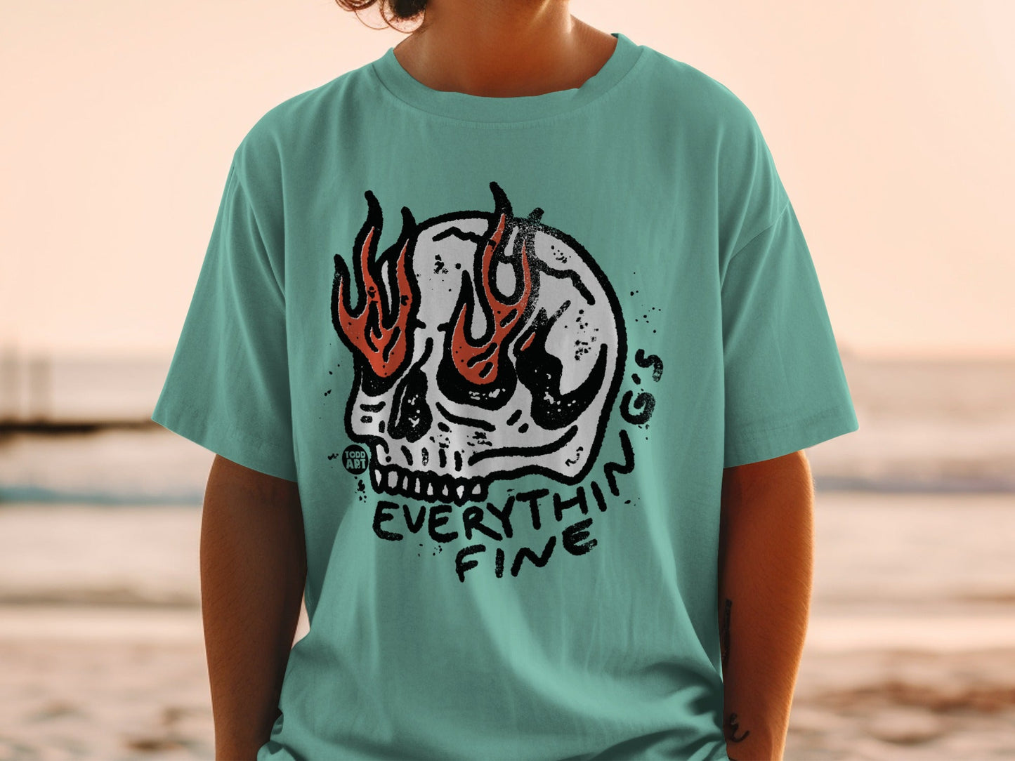 Teal t-shirt with a flaming skull graphic and "EVERYTHING FINE" text.