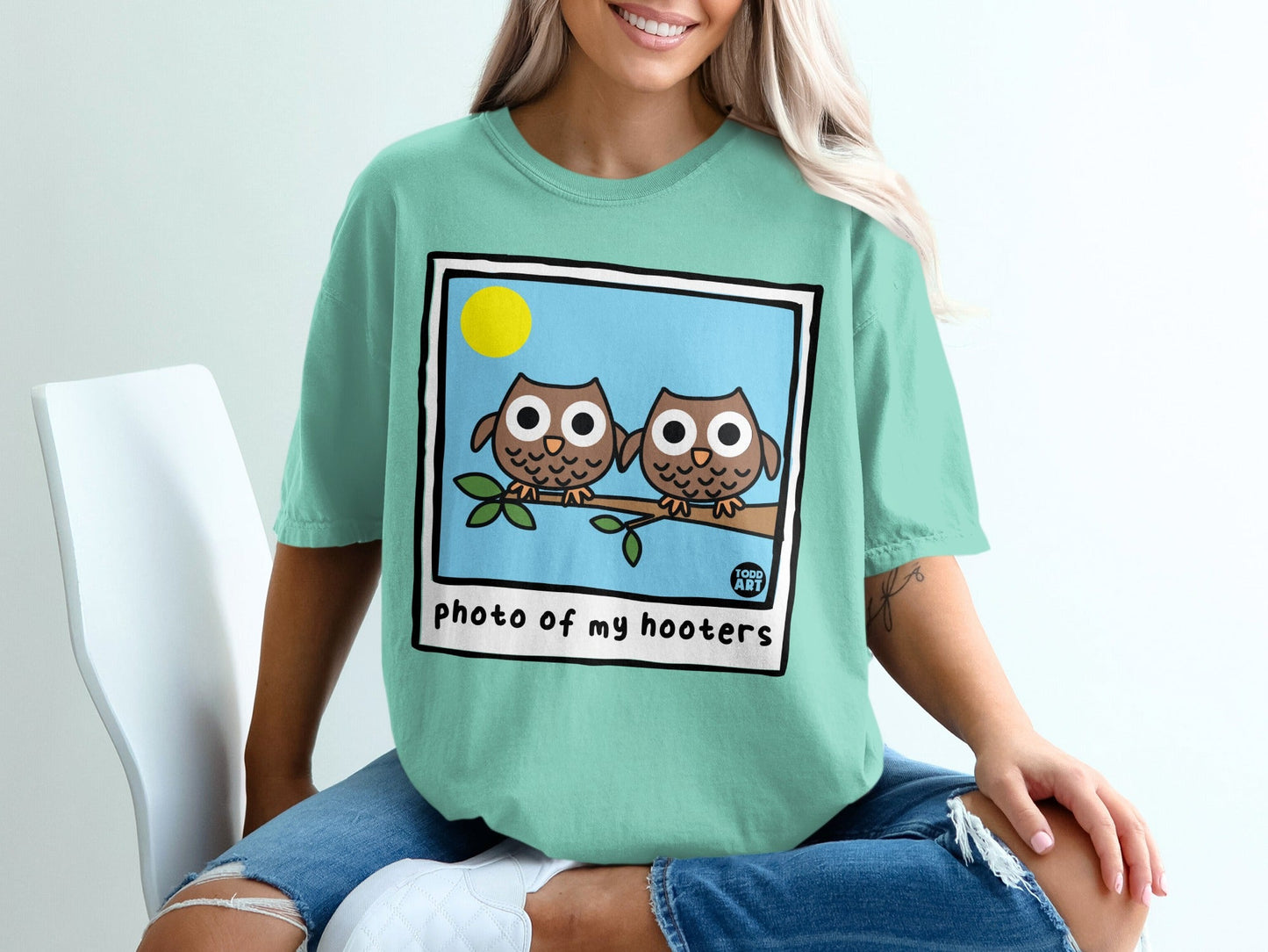 Teal t-shirt with cartoon owls and "photo of my hooters" text.